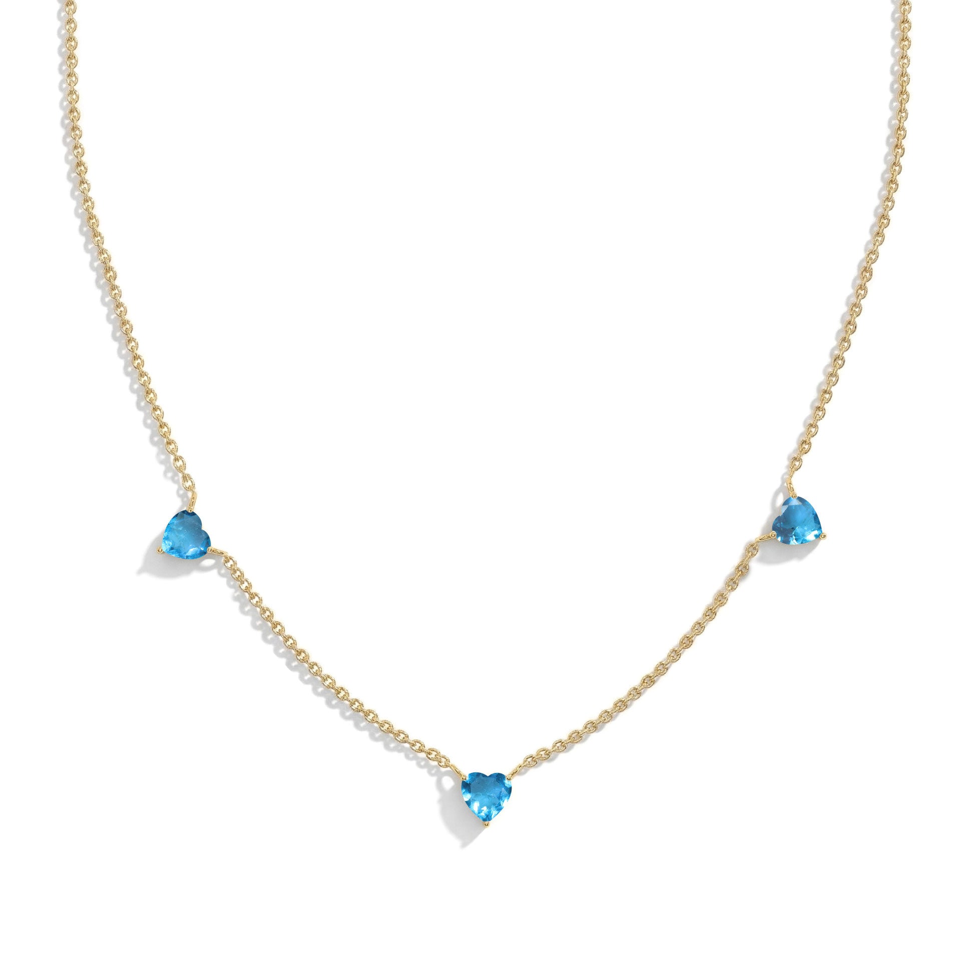 Handmade Natural Blue Topaz Three Stone Heart Necklace in Yellow Gold Filled.
