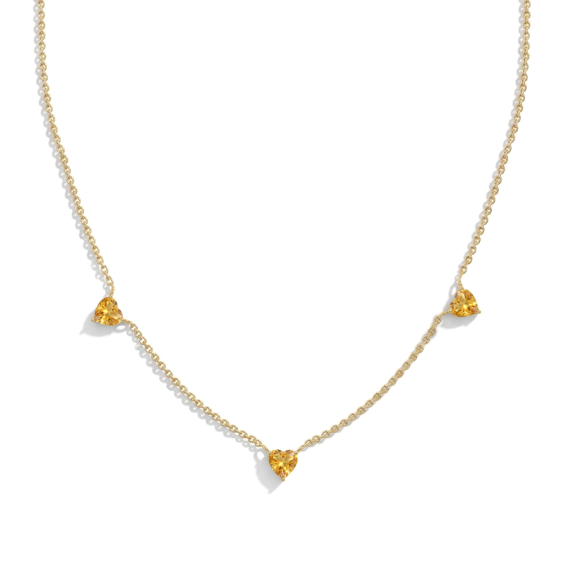Fine jewelry Natural Citrine necklace with three heart-shaped gemstones.
