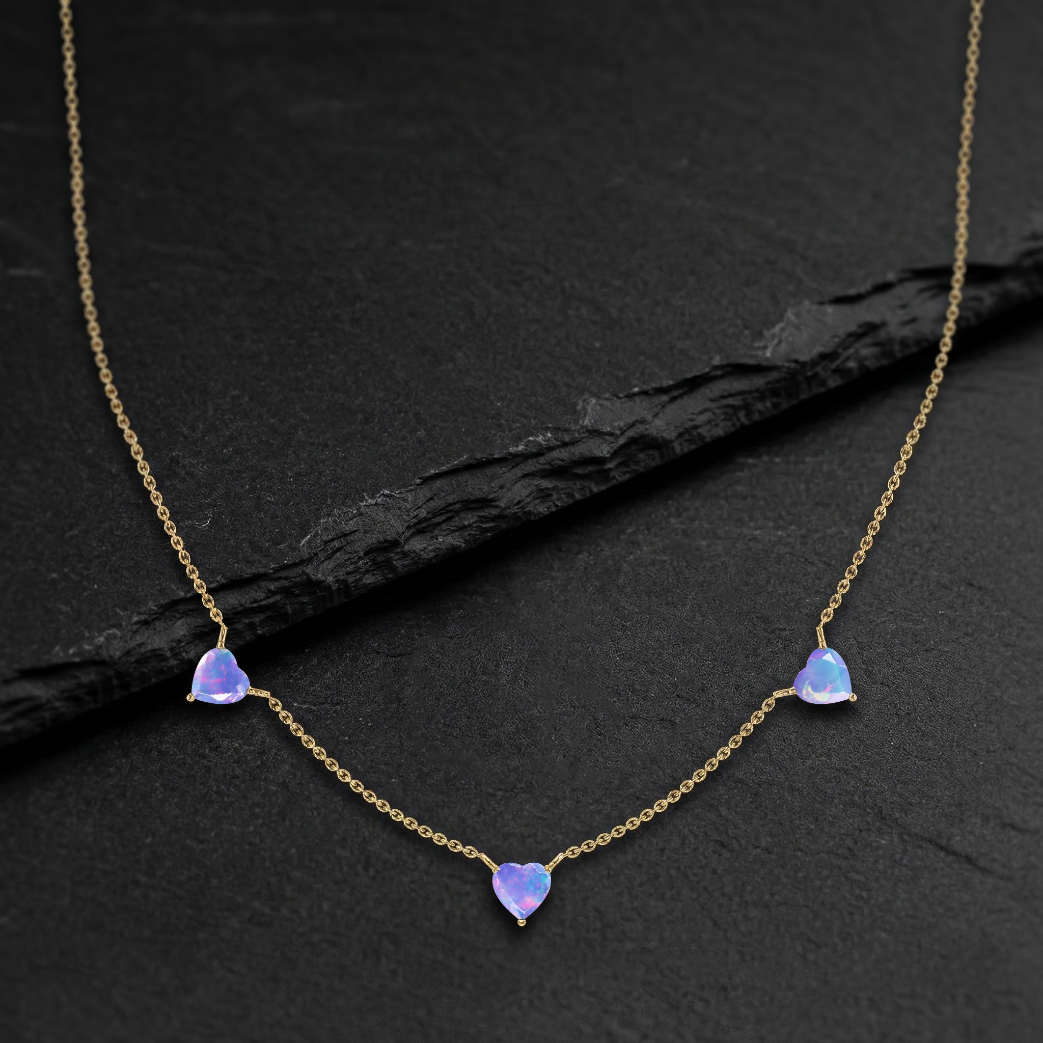 Lavender Opal Three Stone Heart Necklace available in Sterling Silver, Yellow Gold Filled, and Rose Gold Filled.
