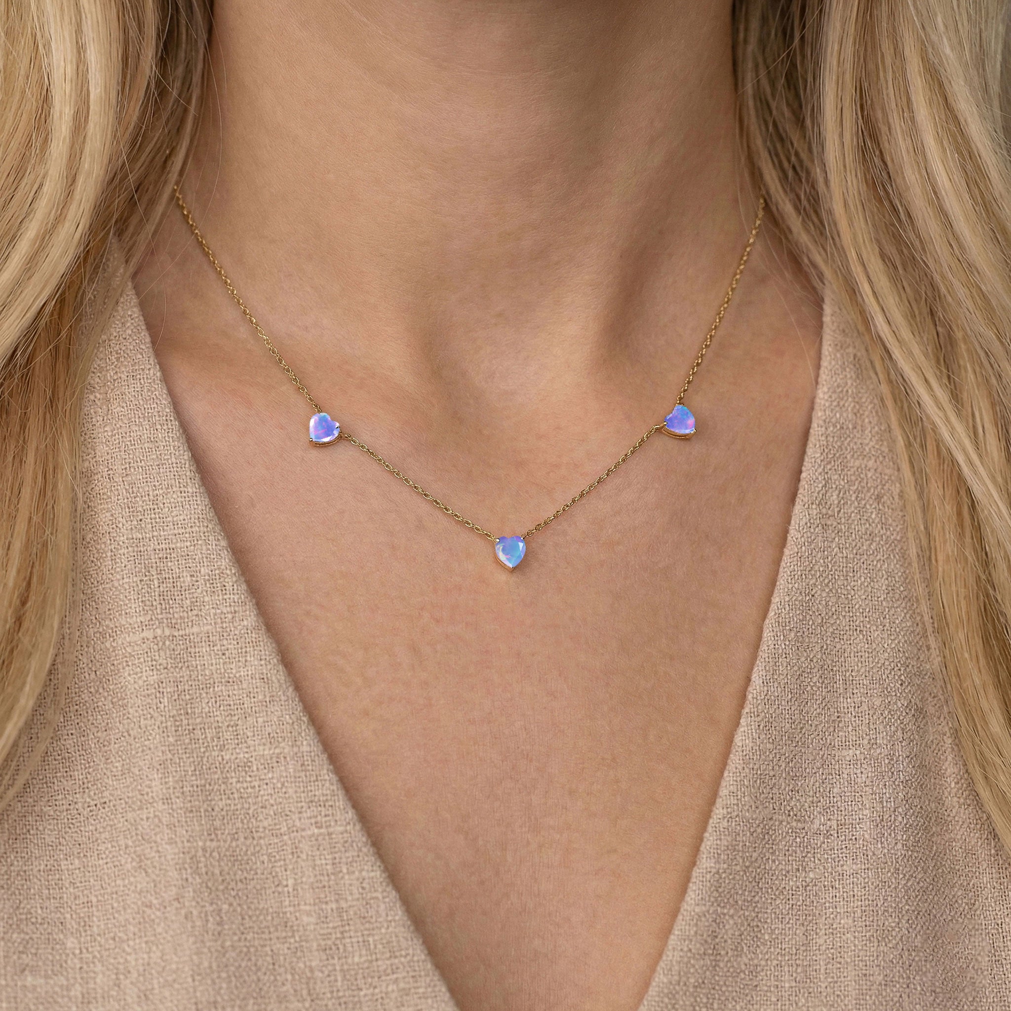 Three heart-cut Lavender Opal gemstones set in a handcrafted Sterling Silver necklace.
