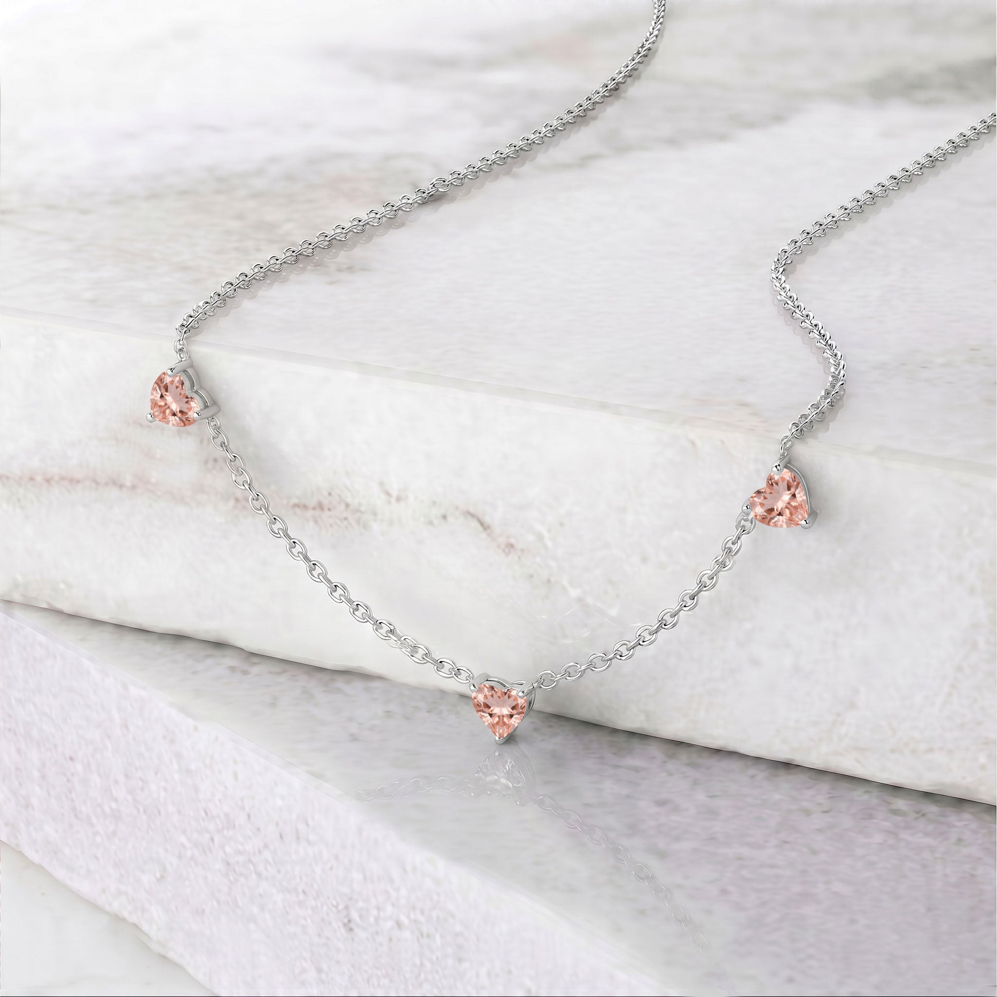 Genuine AAA Morganite Heart Necklace with three 6mm heart-cut gemstones.
