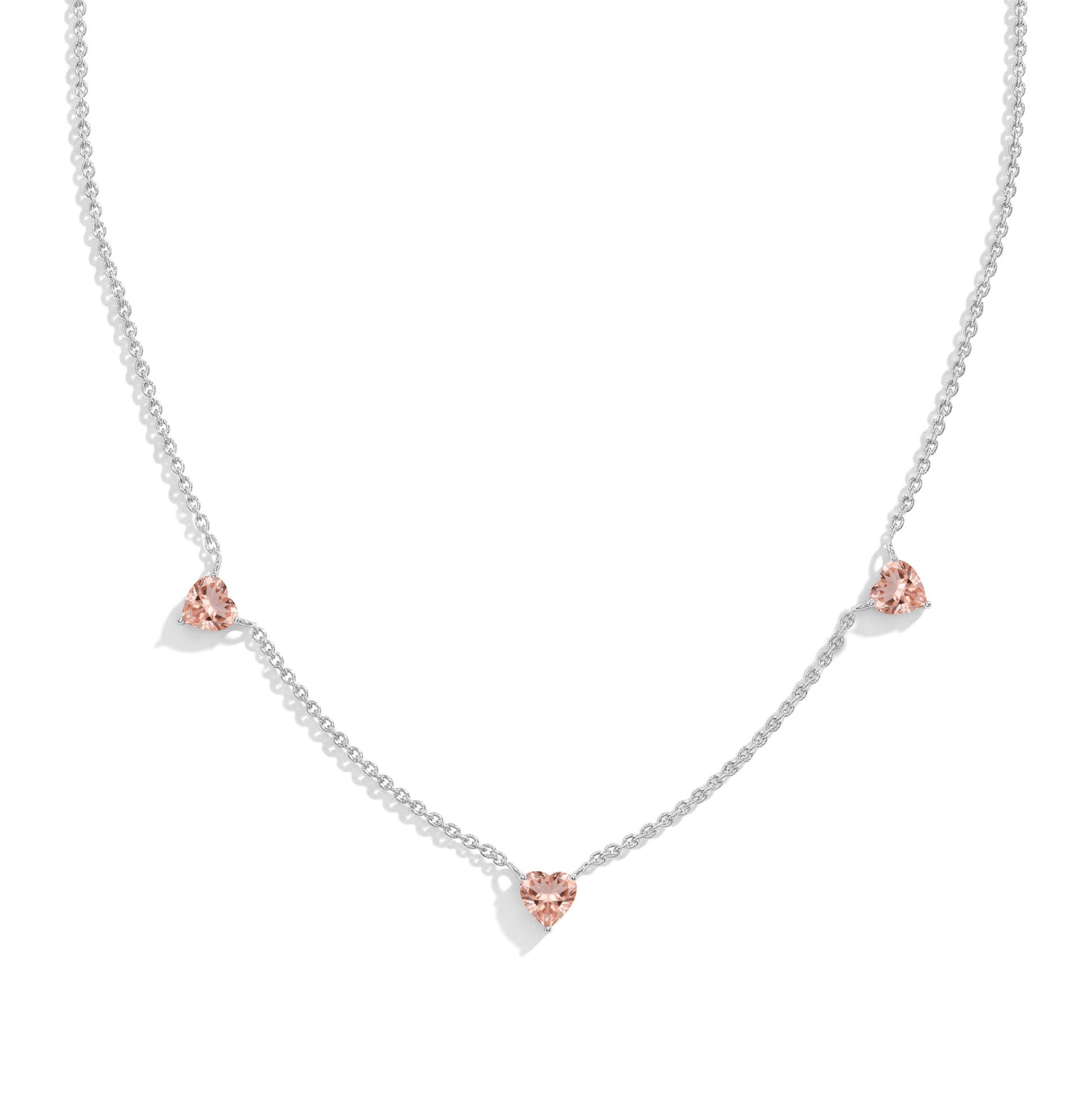 "AAA Grade Morganite Three Stone Heart Necklace in 925 Sterling Silver with genuine heart-cut gemstones.
