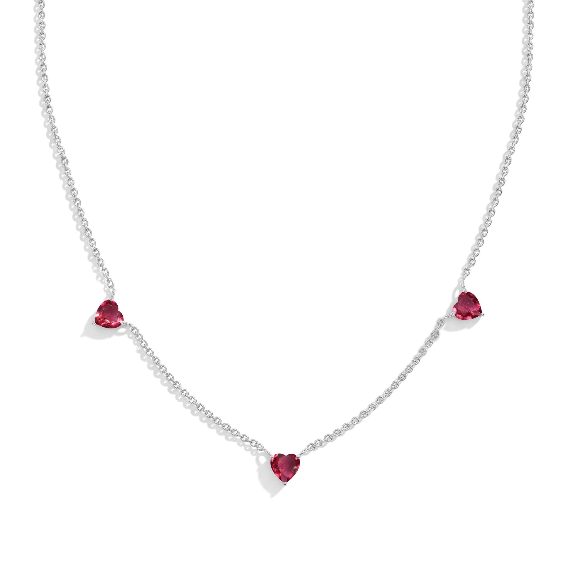 "AAA Grade Pink Tourmaline Three Stone Heart Necklace in 925 Sterling Silver with genuine heart-cut gemstones.
