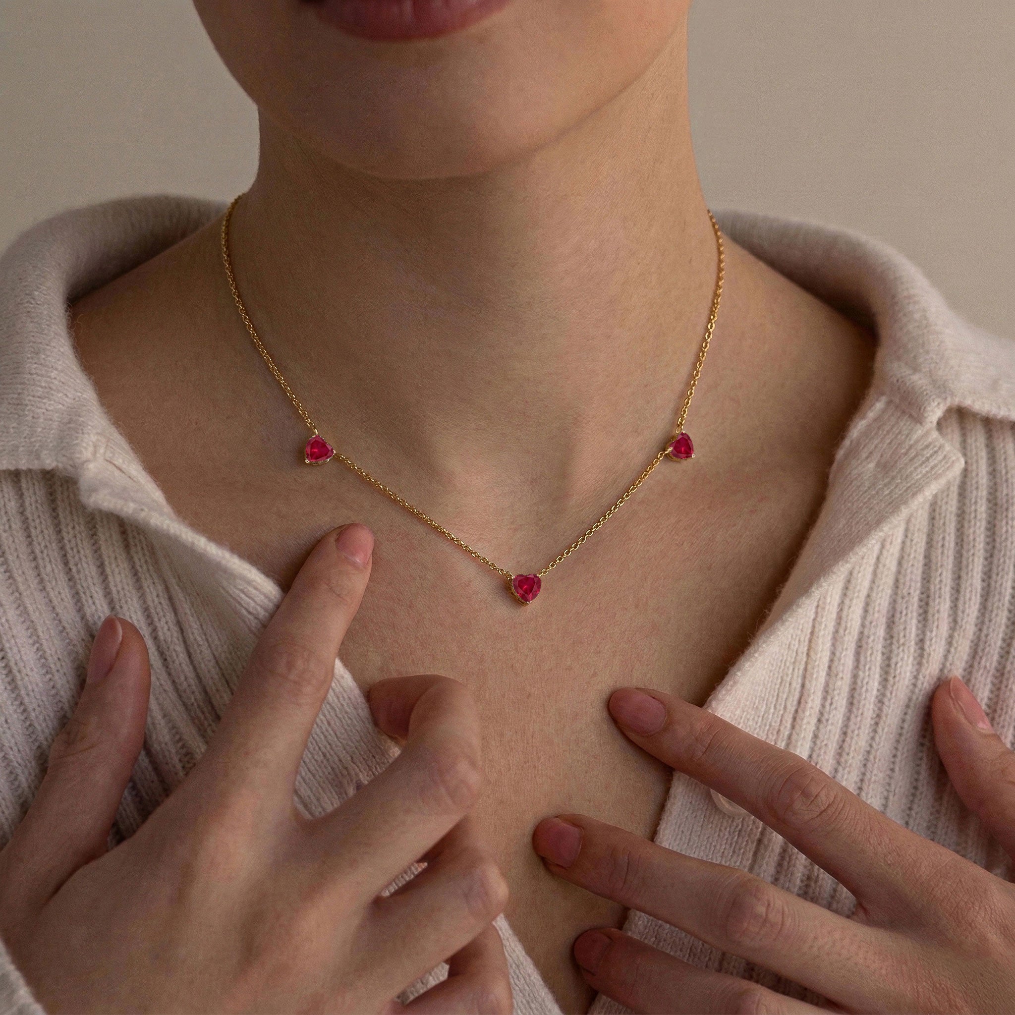 Ruby Three Stone Heart Necklace available in sterling silver and gold filled.
