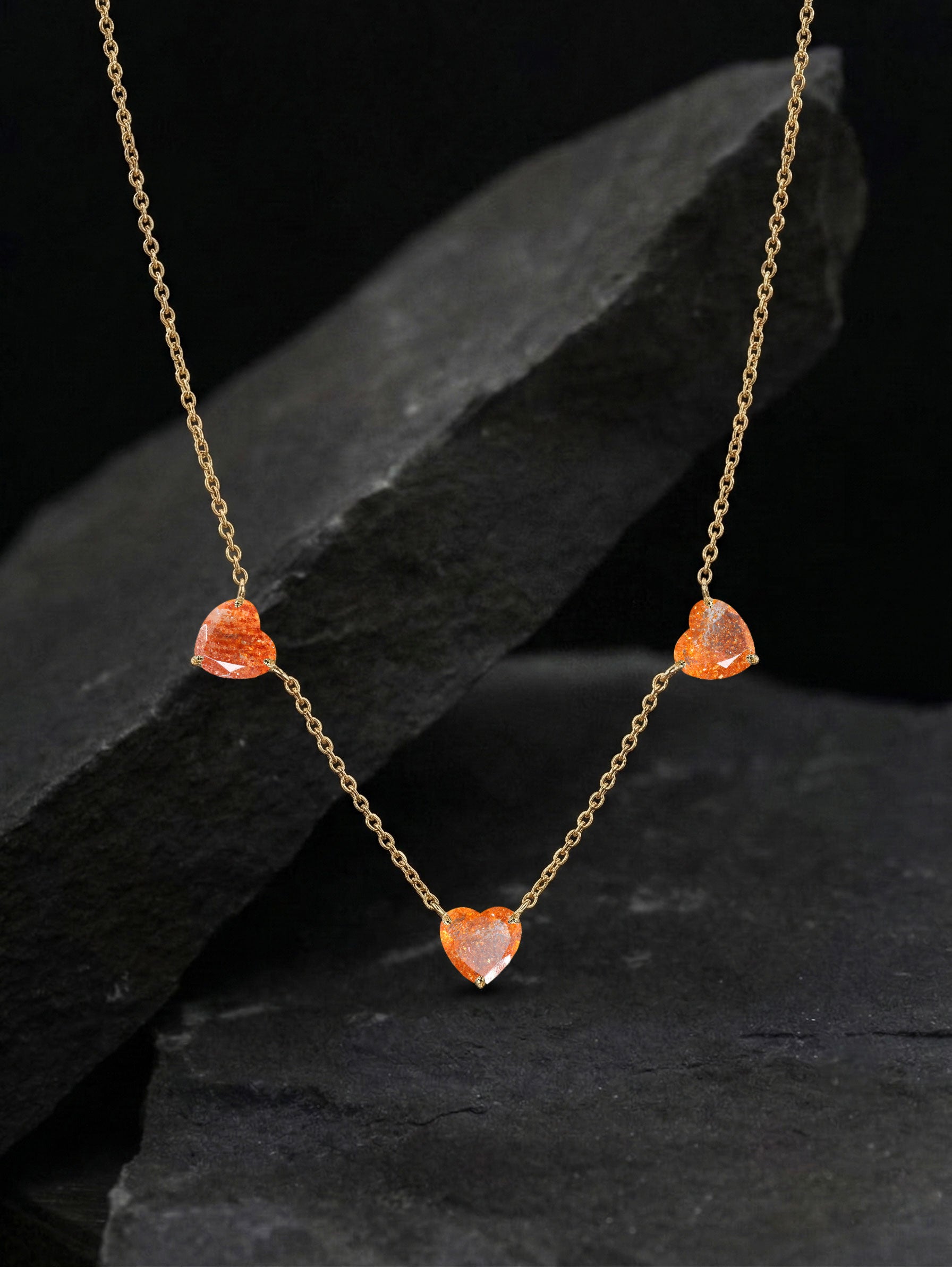 Elegant Three Stone Sunstone Heart Necklace with genuine natural gemstones and gold chain.
