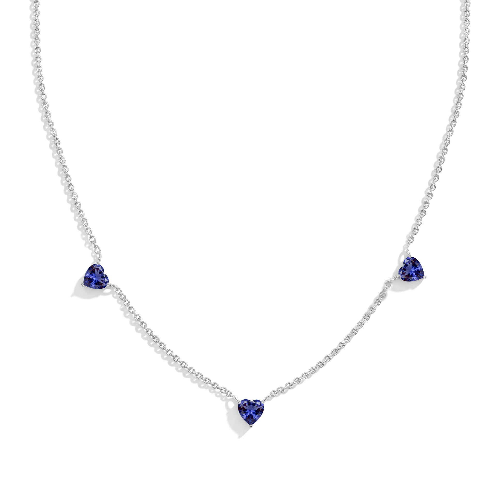 "AAA Grade Tanzanite Three Stone Heart Necklace in 925 Sterling Silver with genuine heart-cut gemstones.

