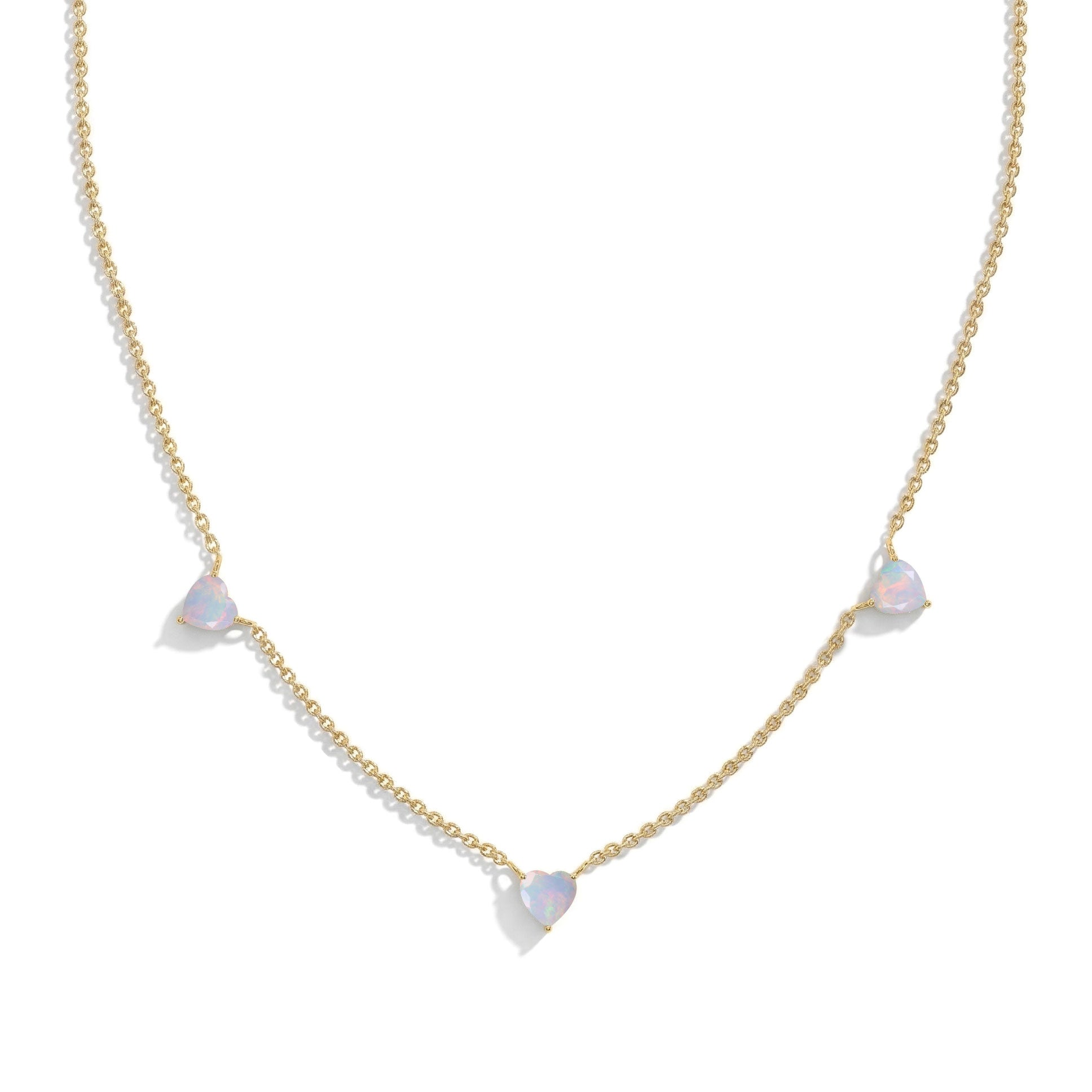 Fine jewelry White Opal necklace with three heart-shaped opal gemstones.
