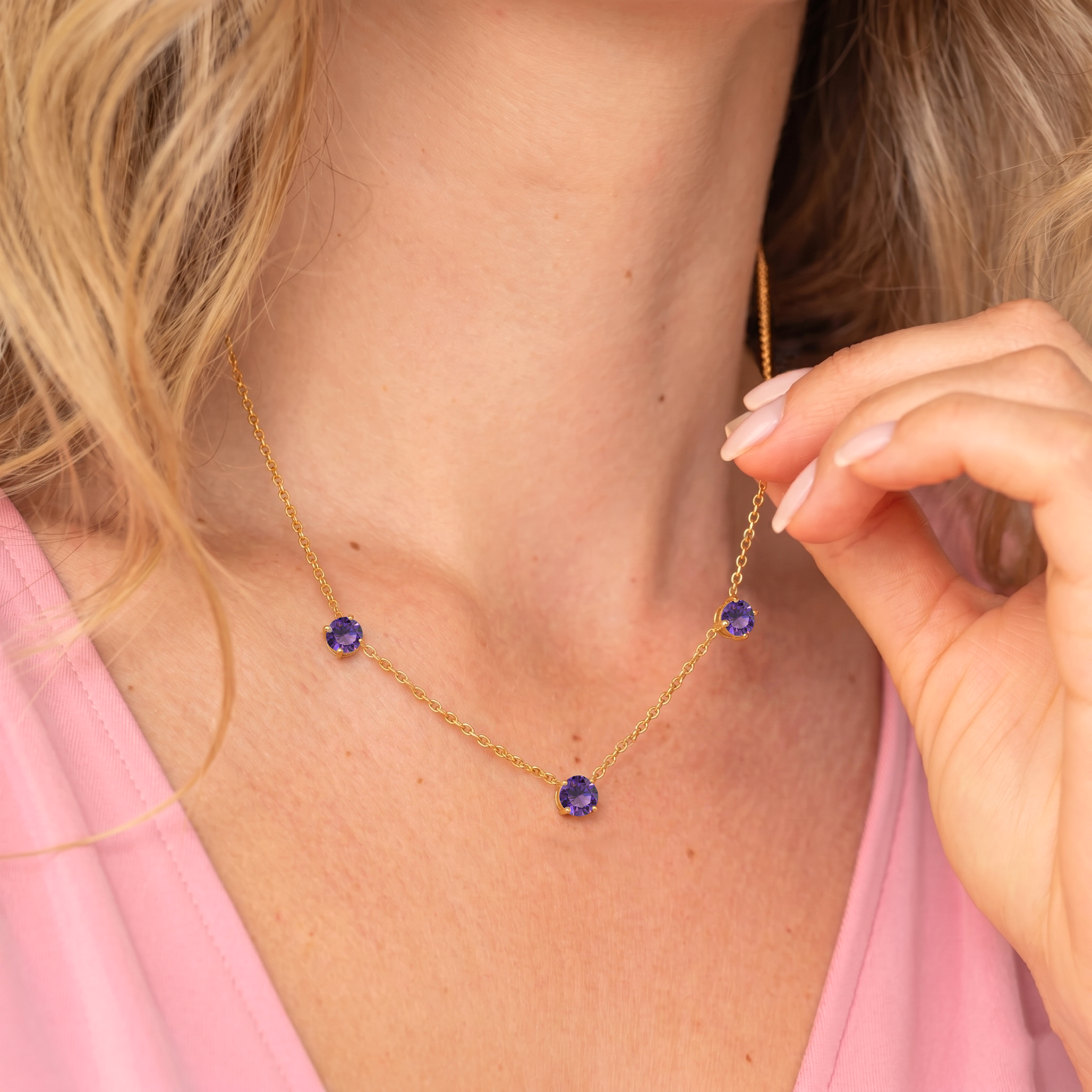 Fine jewelry Amethyst necklace with classic three stone station design.
