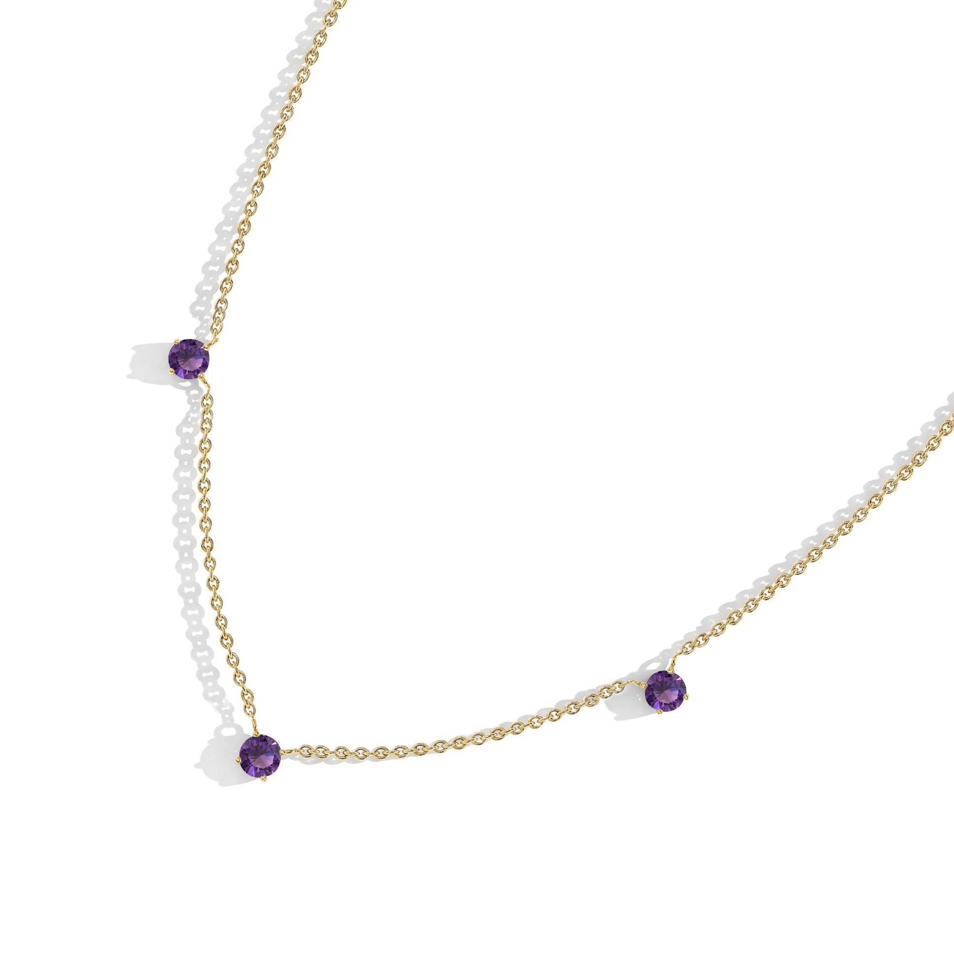 Modern Amethyst necklace design featuring round purple gemstones for women.
