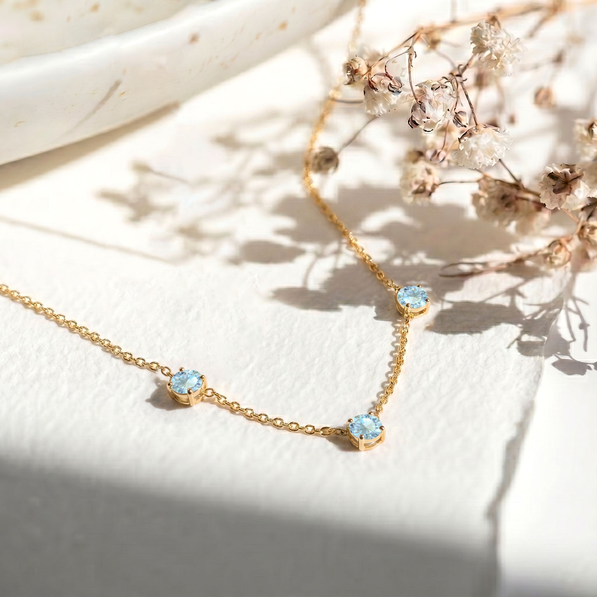 Genuine Aquamarine gemstone necklace featuring three round stones for women.

