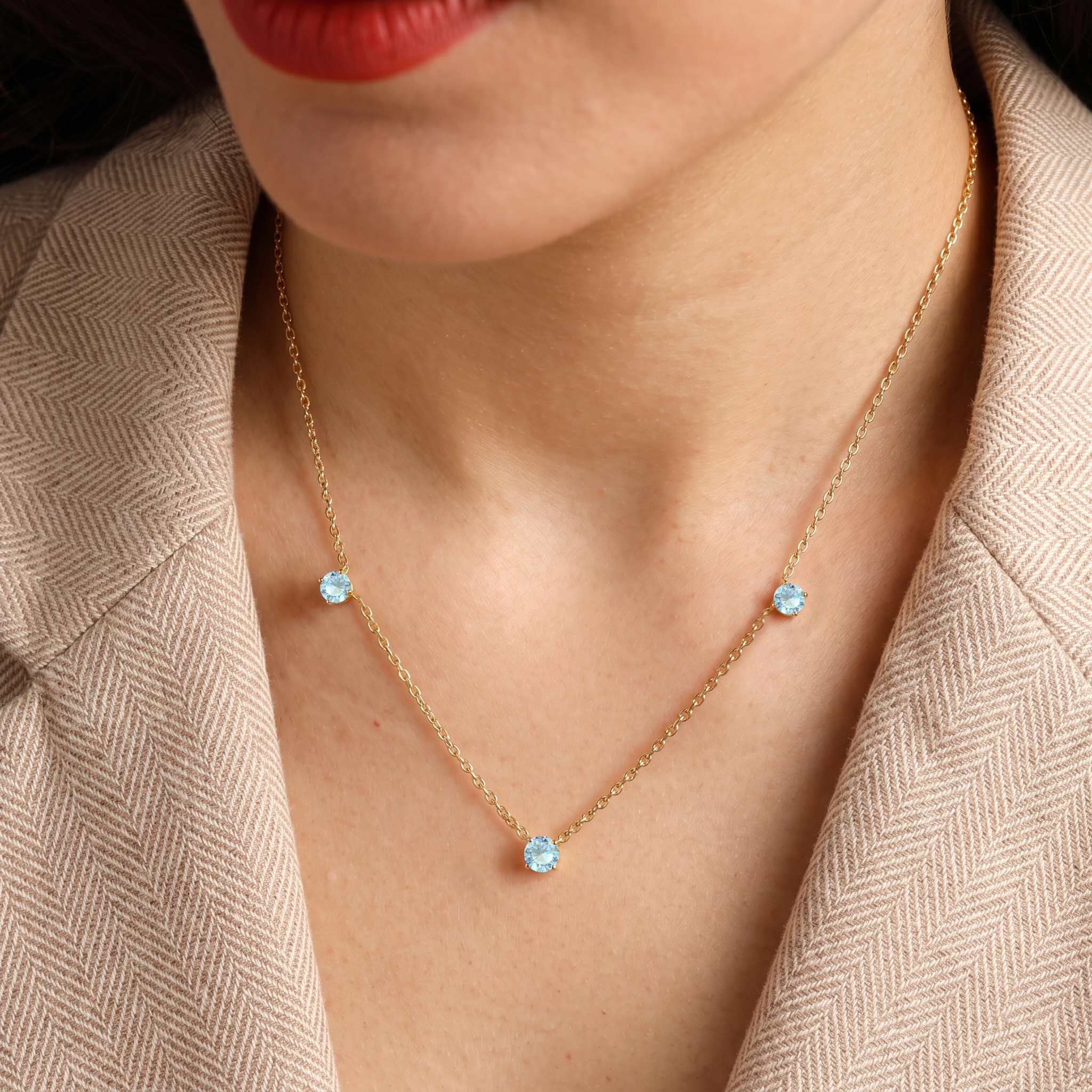 Fine jewelry Aquamarine necklace with classic three stone station design.
