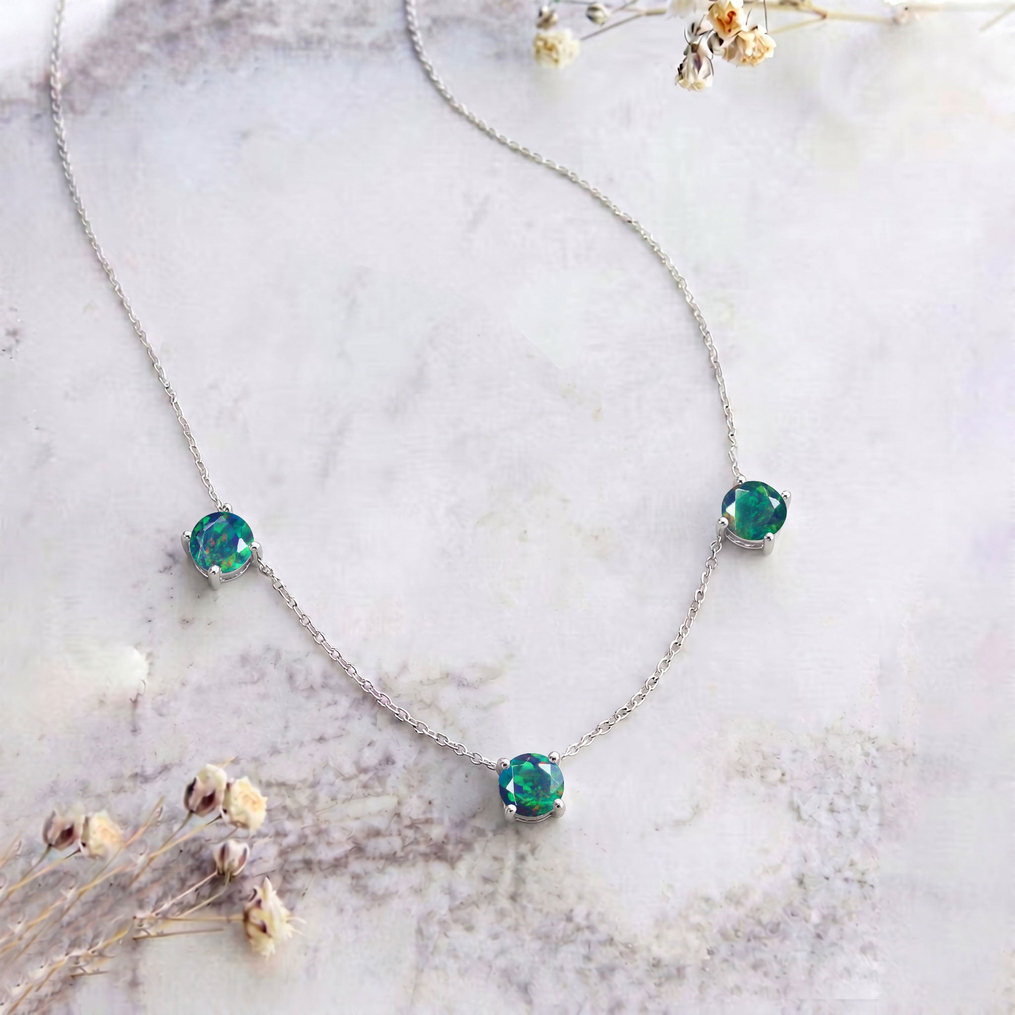 Three stone Black Opal station necklace designed with a minimalist jewelry style.
