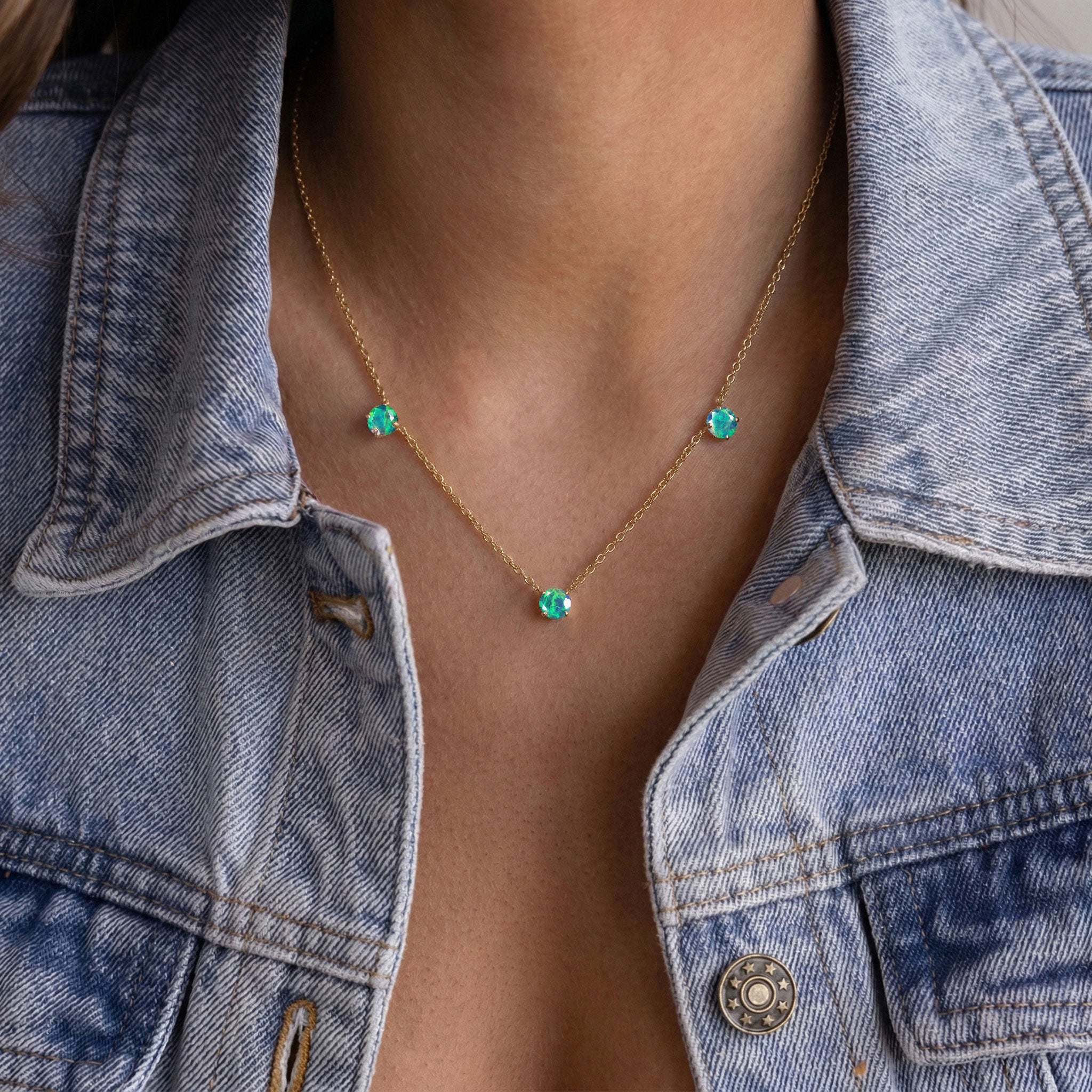 Black Opal station necklace with shimmering multicolor gemstone reflections.
