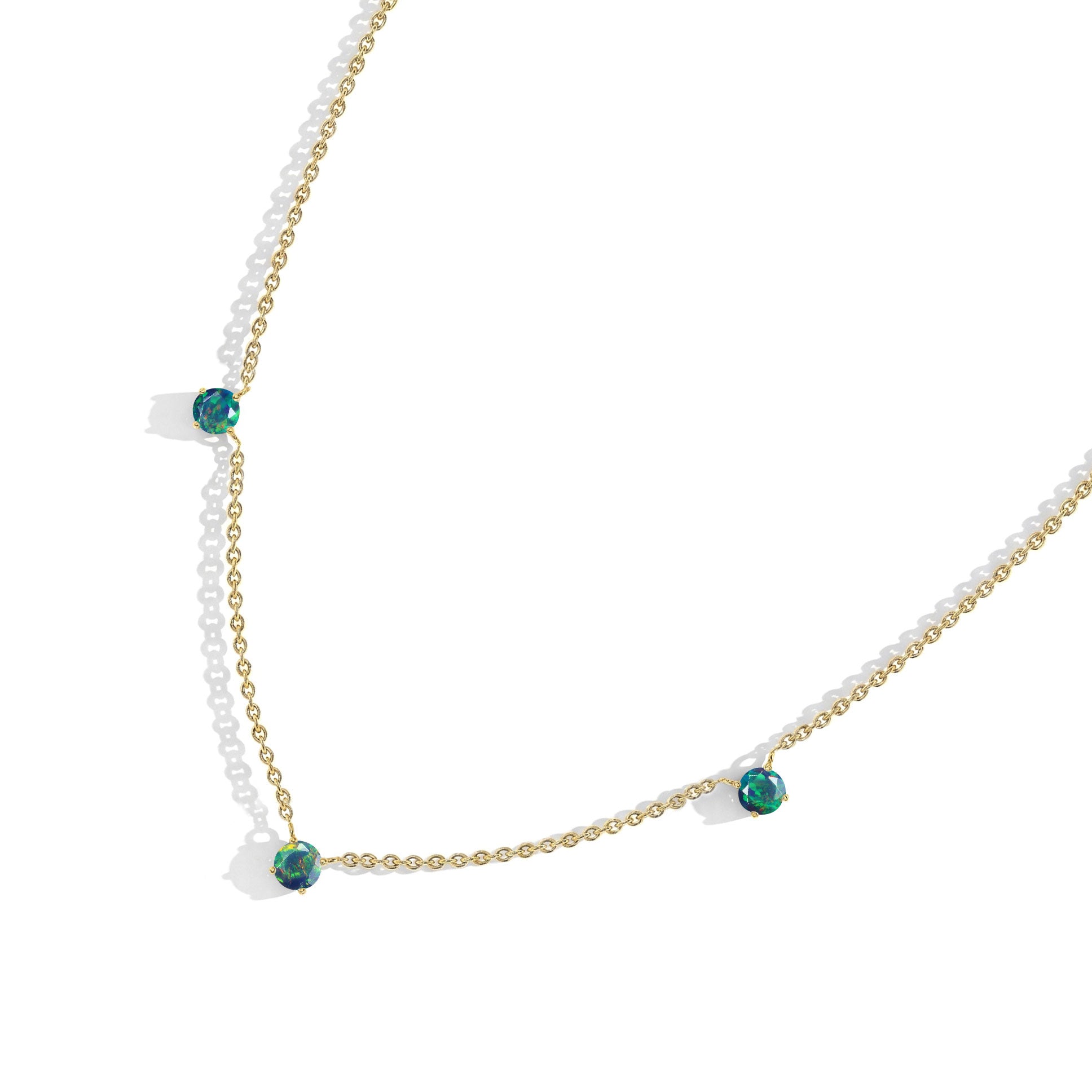 Elegant black gemstone necklace with opal stones for women’s fine jewelry collection.
