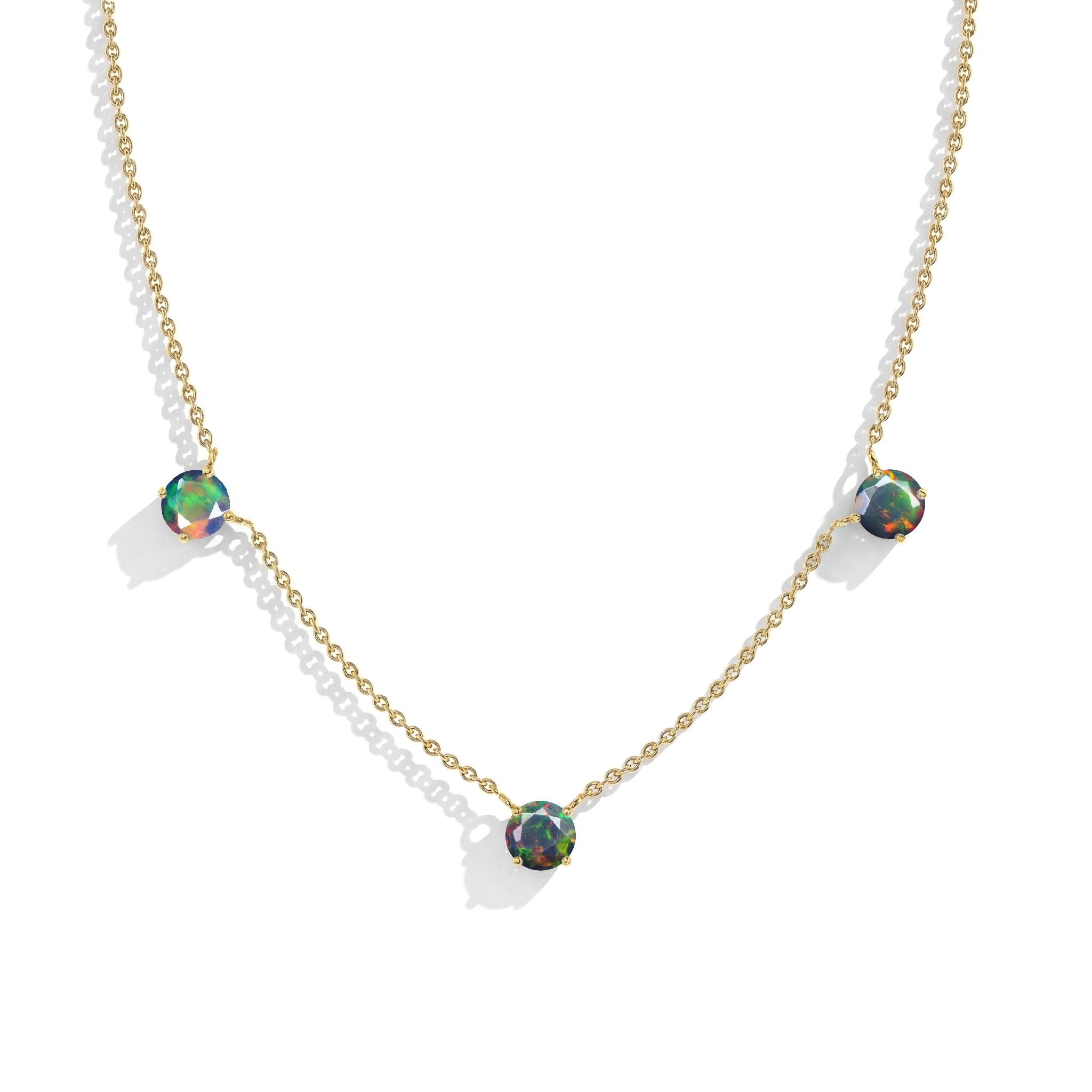 Luxury gemstone necklace featuring black opal stones in sterling silver setting.
