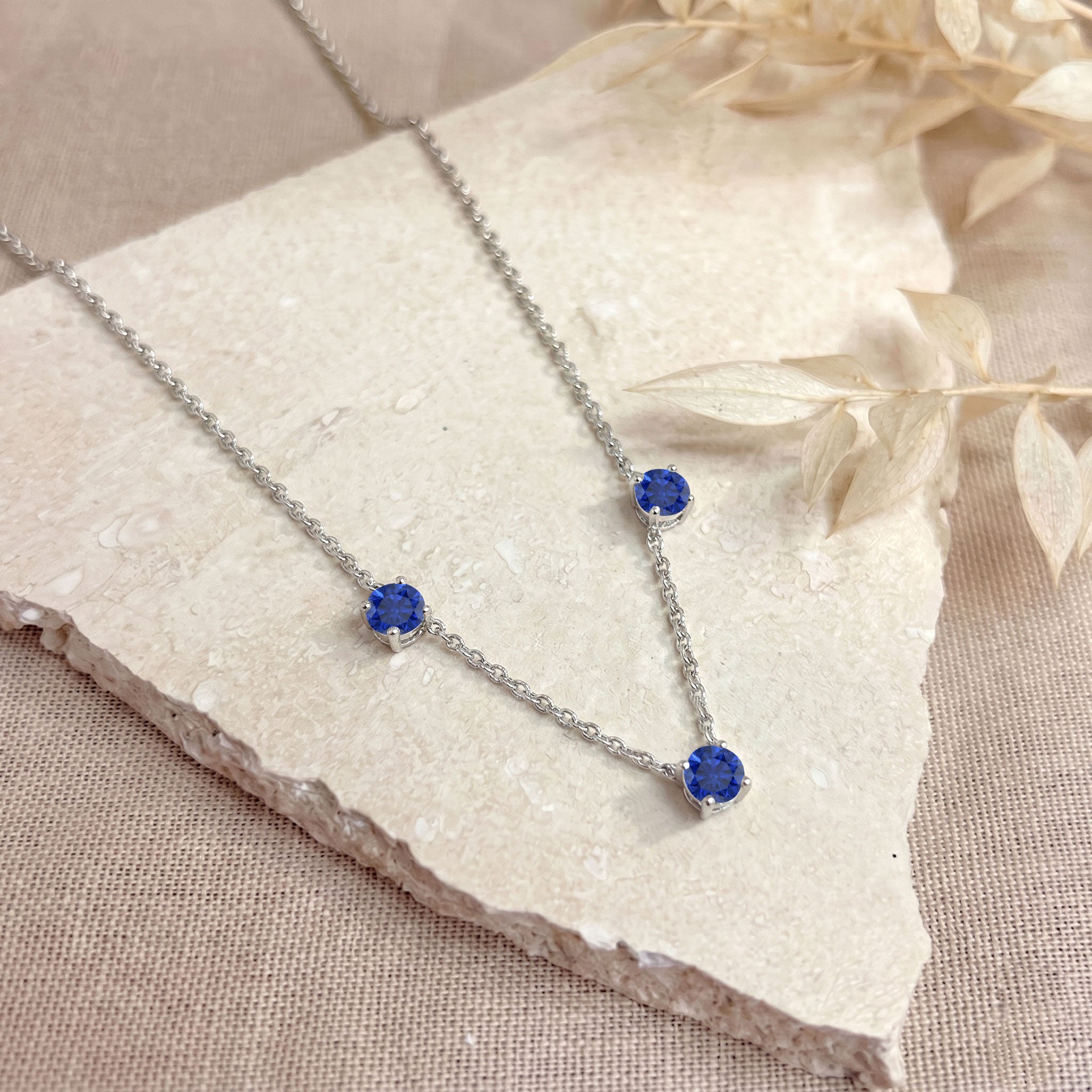 925 Sterling Silver Blue Sapphire necklace with adjustable 16 inch chain and extender.
