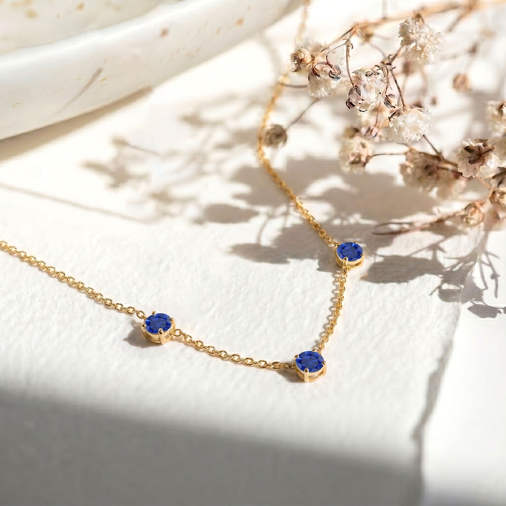 Beautiful Blue Sapphire station necklace available in sterling silver and yellow gold filled.

