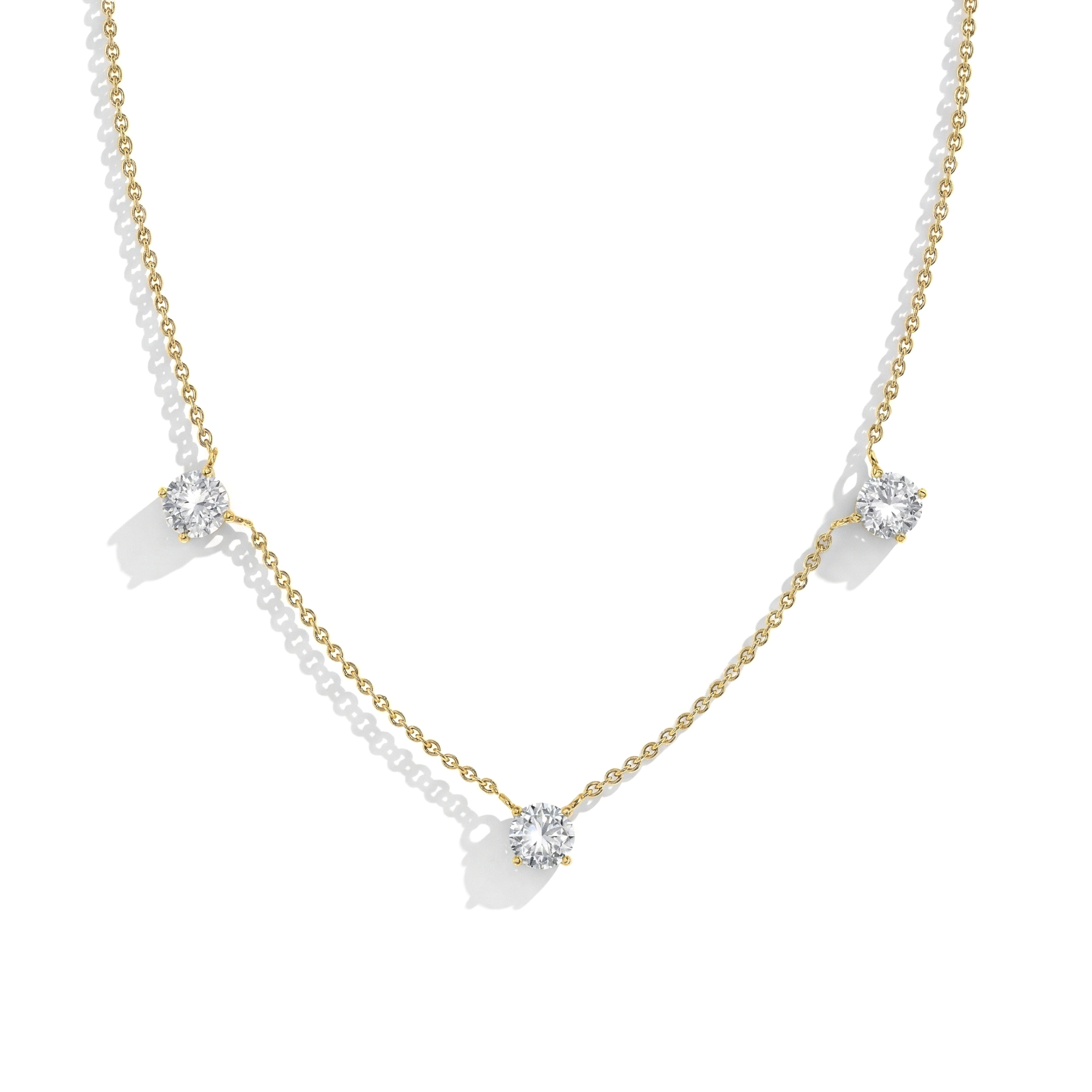 Women's fine jewelry Moissanite necklace with classic station setting.
