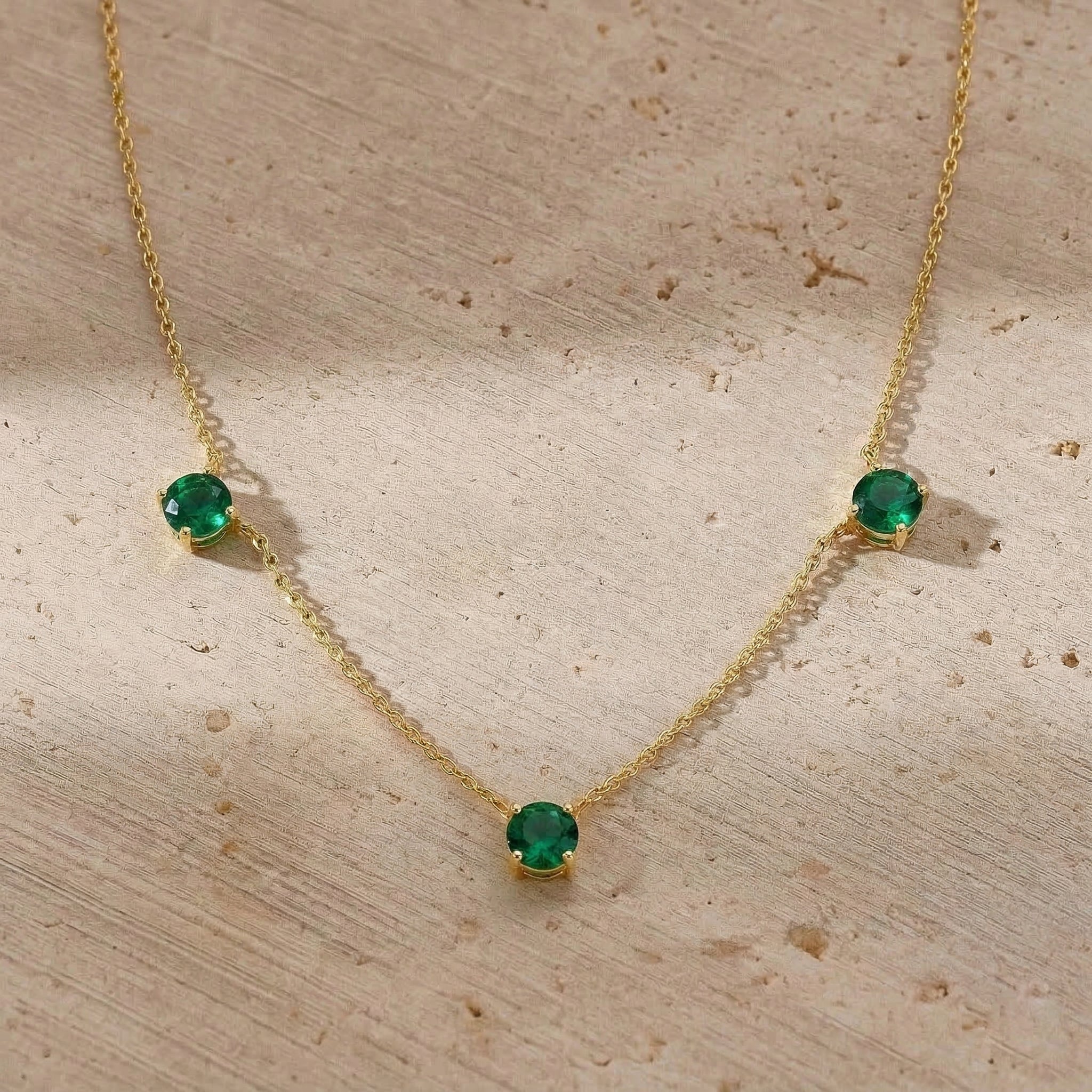 Delicate sterling silver necklace with brilliant Emerald gemstones.
