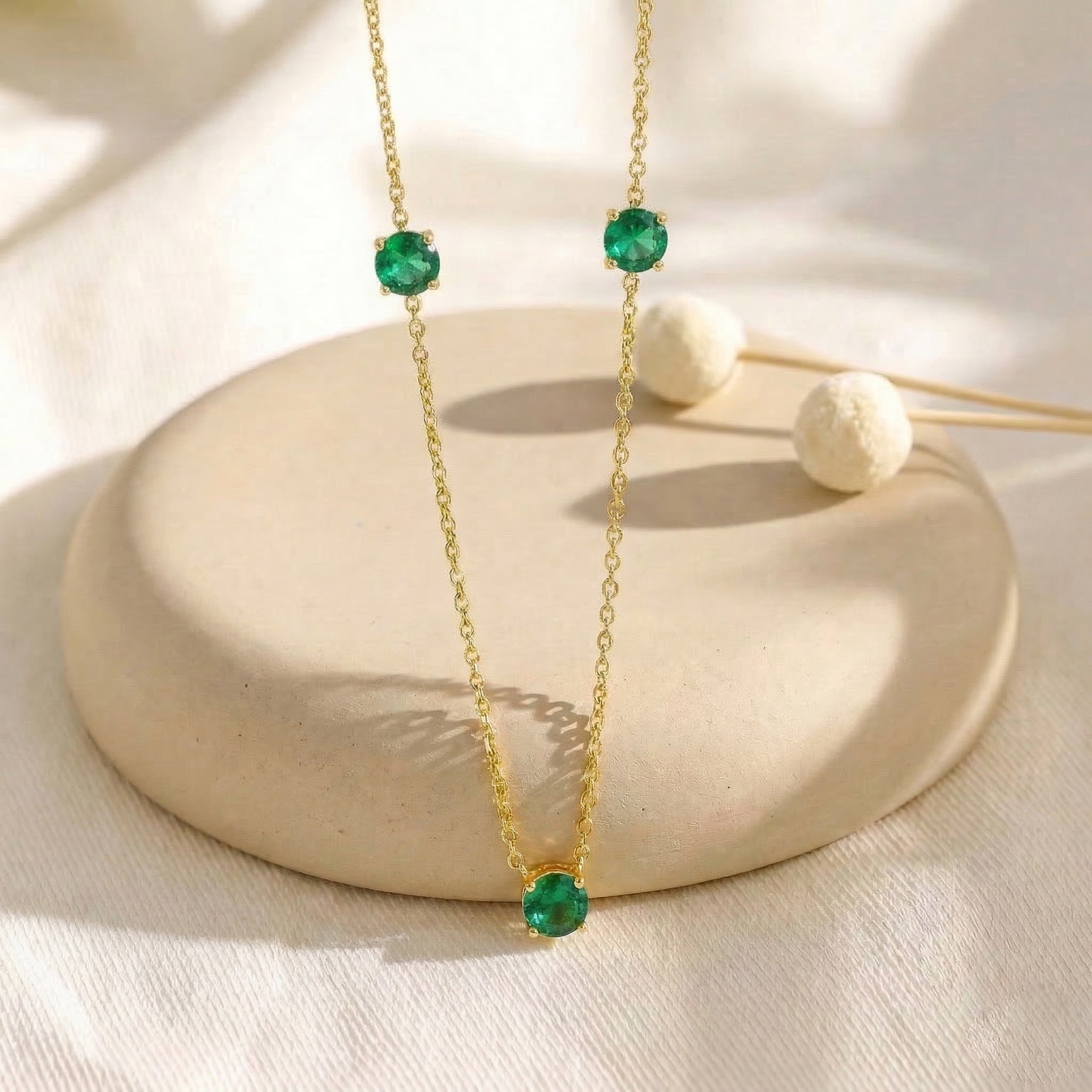 Beautiful Emerald station necklace available in sterling silver and yellow gold filled.
