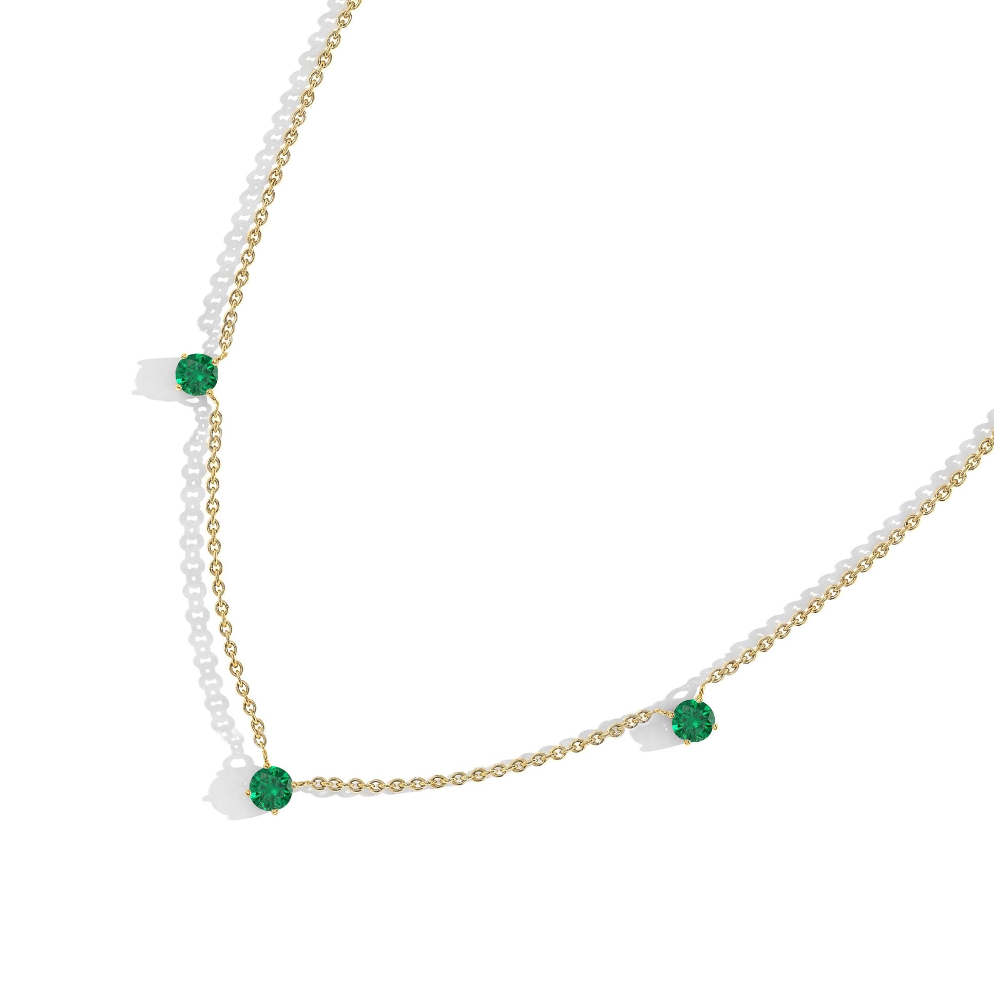 Dainty Emerald station necklace with natural gemstone beauty and timeless elegance.