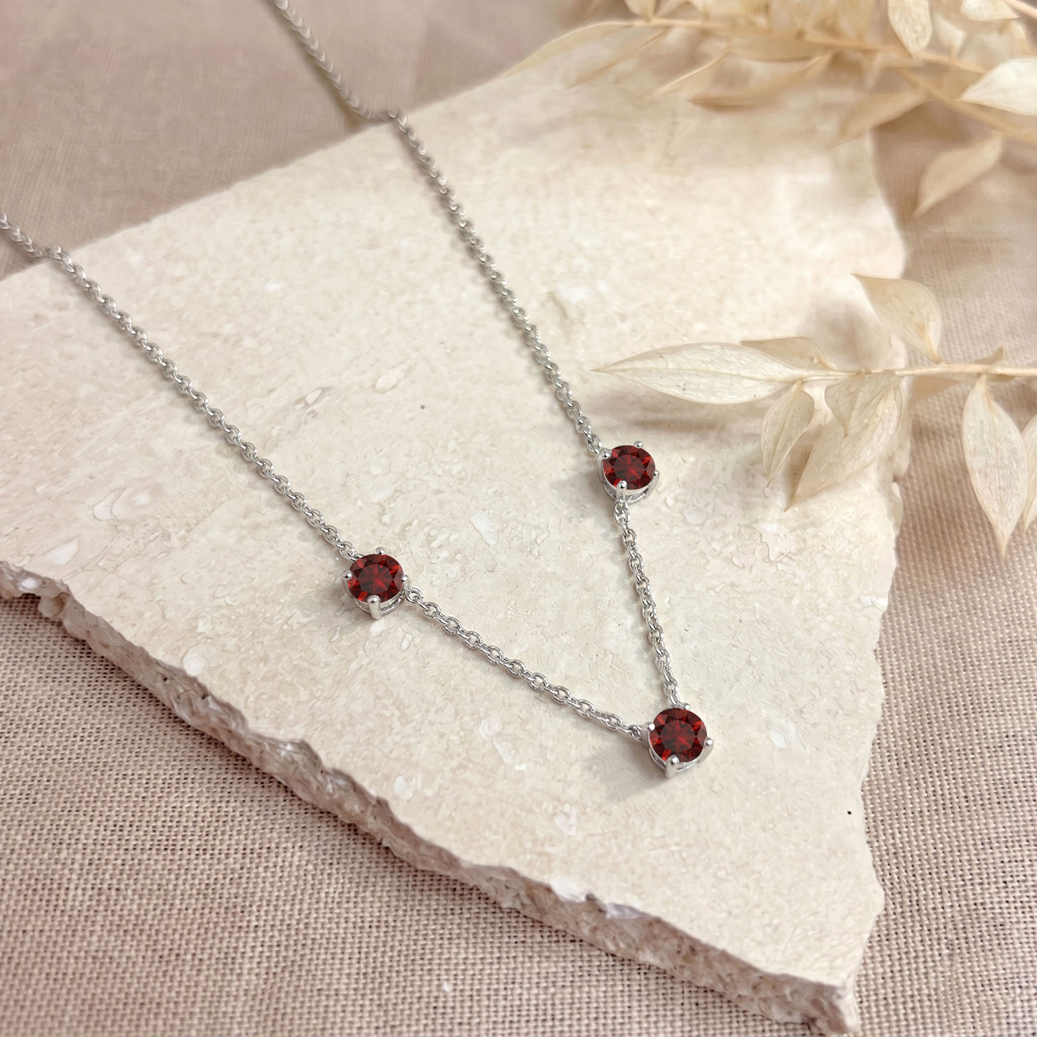 925 Sterling Silver Garnet necklace with adjustable 16 inch chain and extender.
