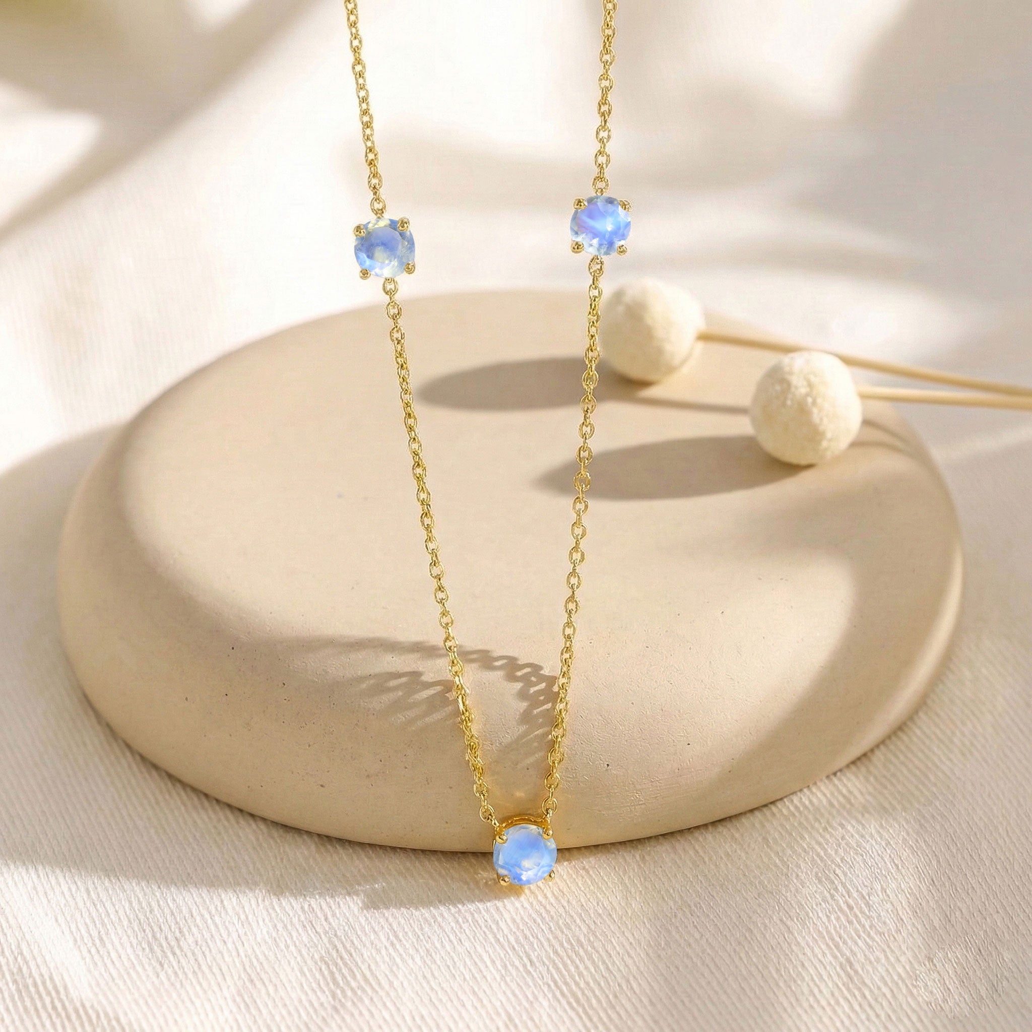 Moonstone station necklace available in sterling silver and yellow gold filled designs.
