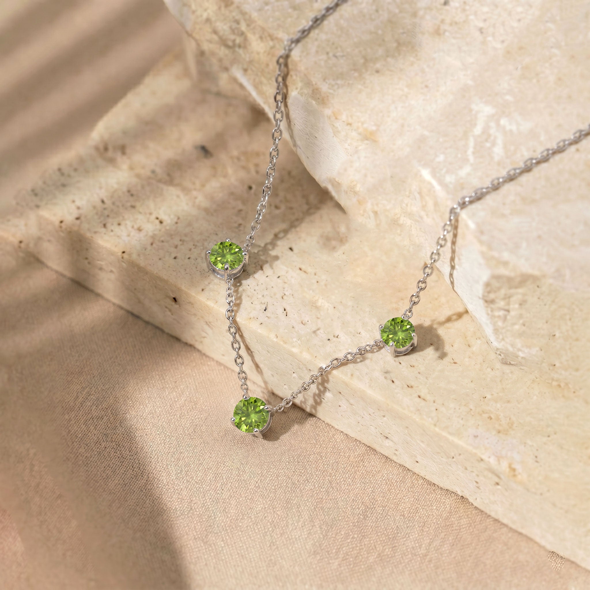 Three stone Peridot necklace designed with a minimalist and timeless jewelry style.
