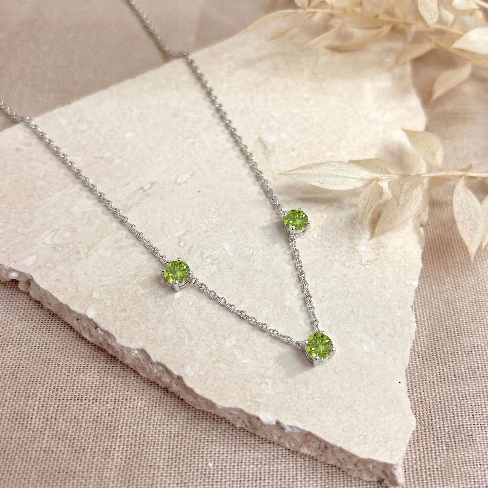925 Sterling Silver Peridot necklace with adjustable 16 inch chain and extender.
