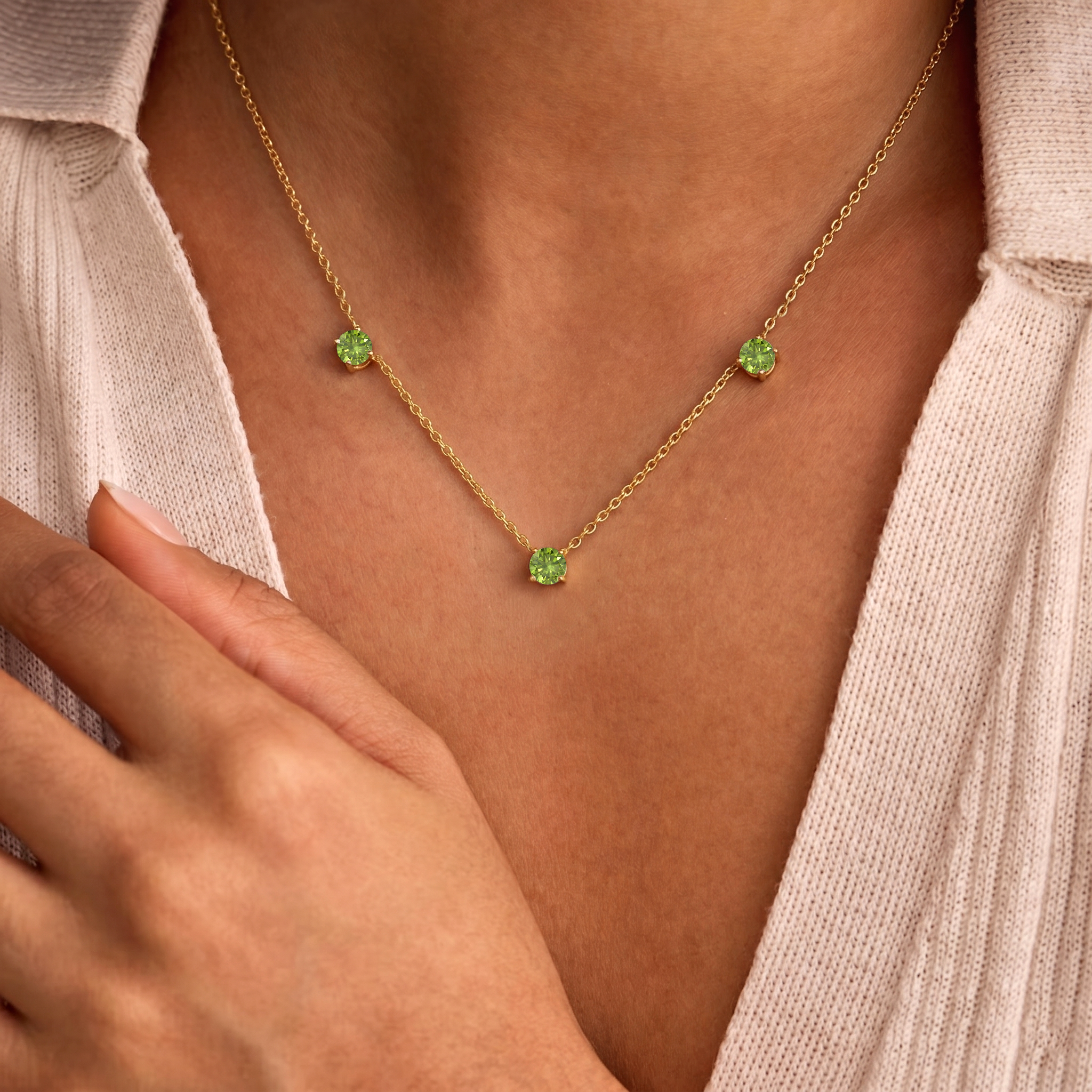 Genuine Peridot gemstone necklace featuring three round stones for women.
