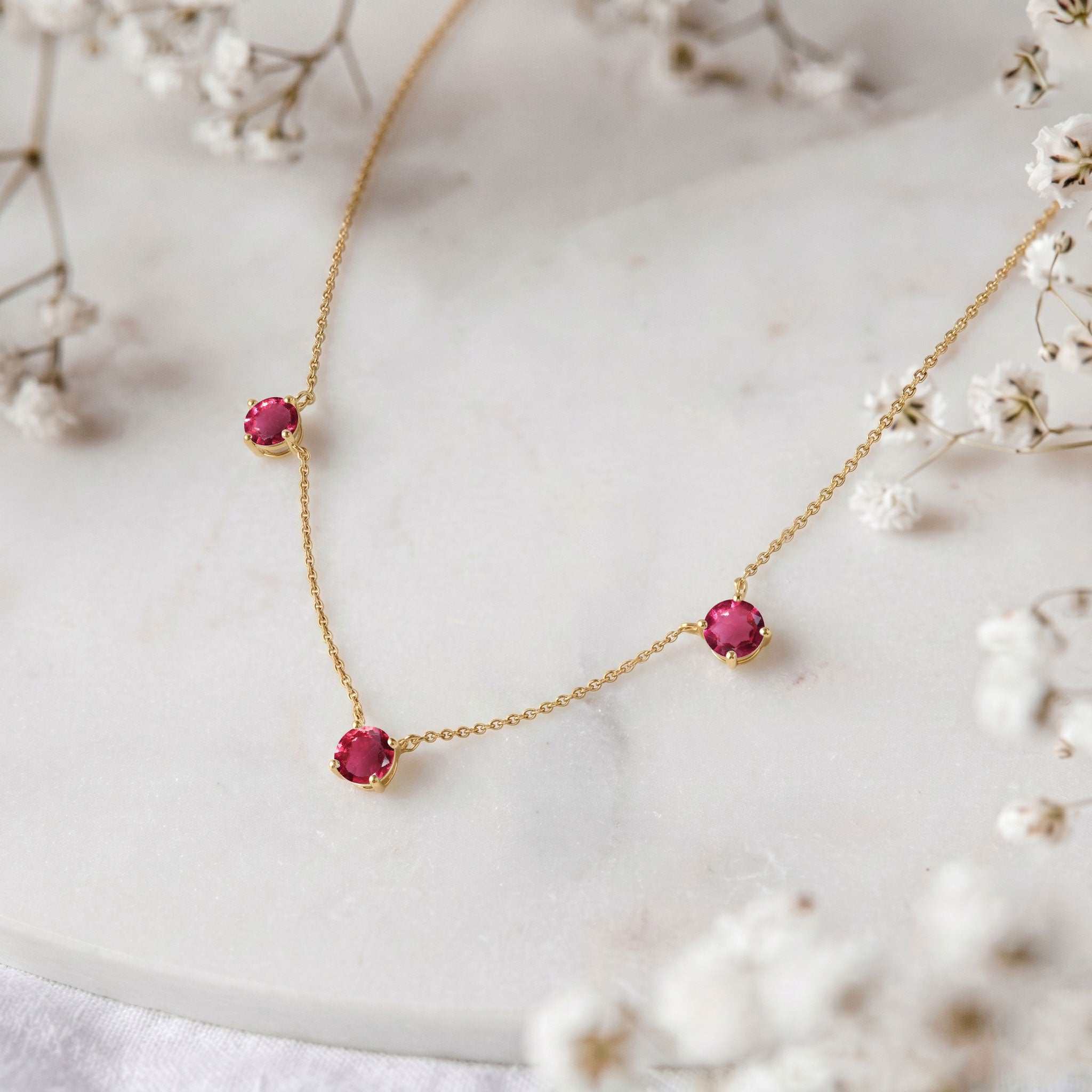 Pink Tourmaline station necklace available in sterling silver and yellow gold filled designs.
