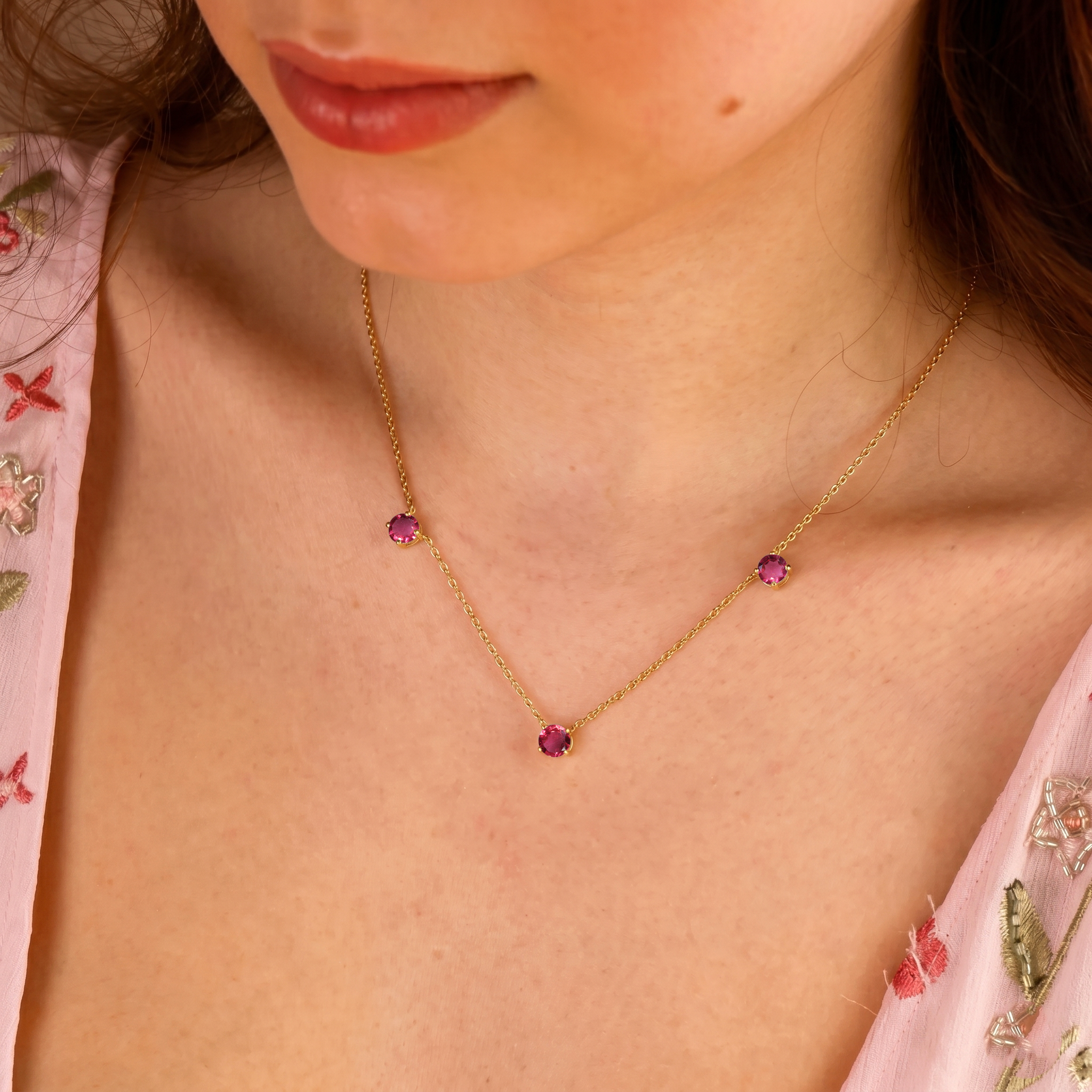 Fine jewelry Pink Tourmaline necklace with classic three stone station design.

