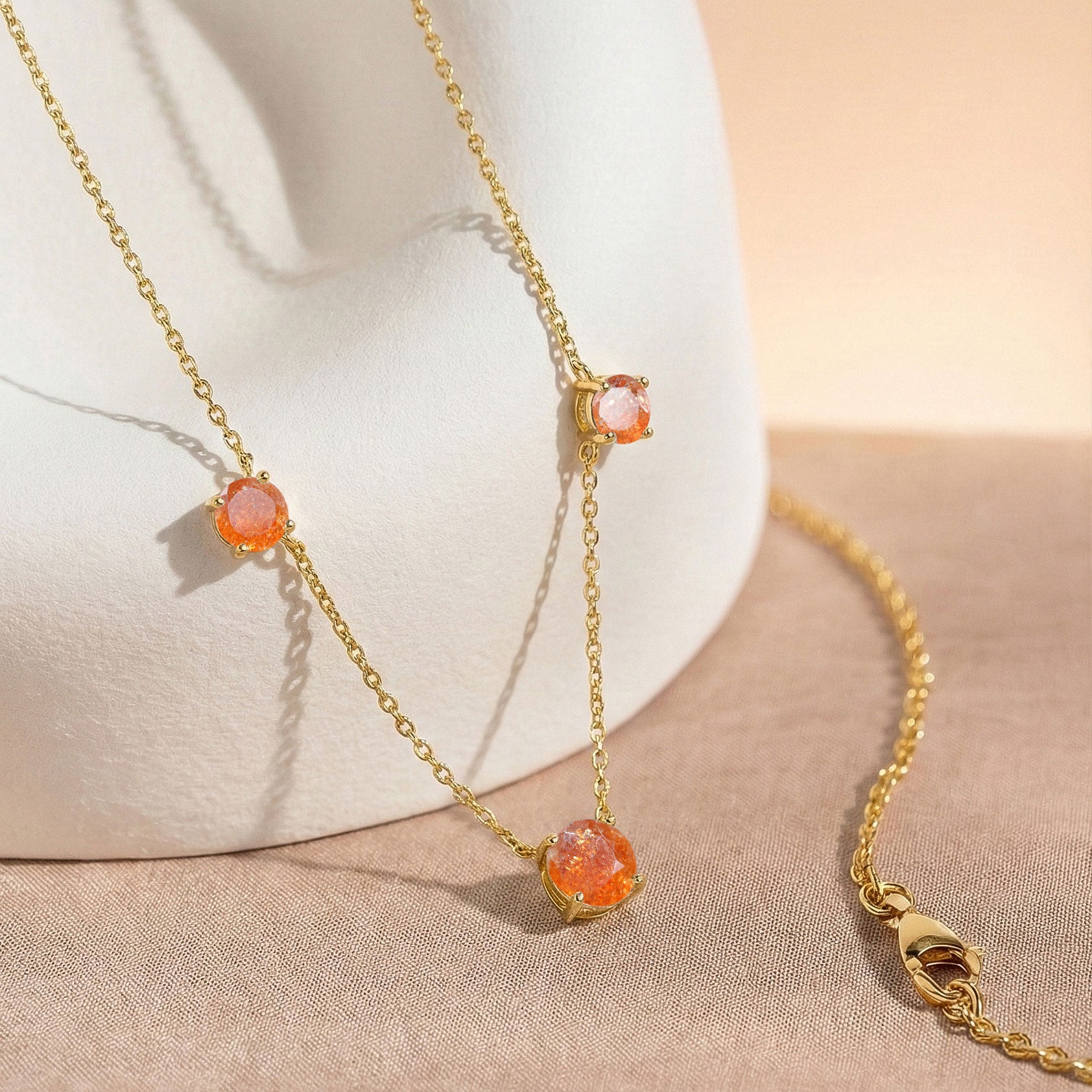Sunstone station necklace available in sterling silver and yellow gold filled designs.
