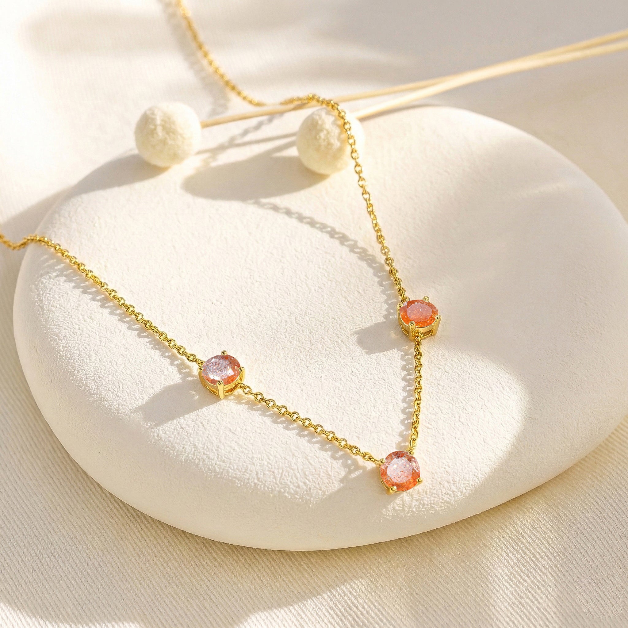 Three stone Sunstone necklace designed with a minimalist and timeless jewelry style.
