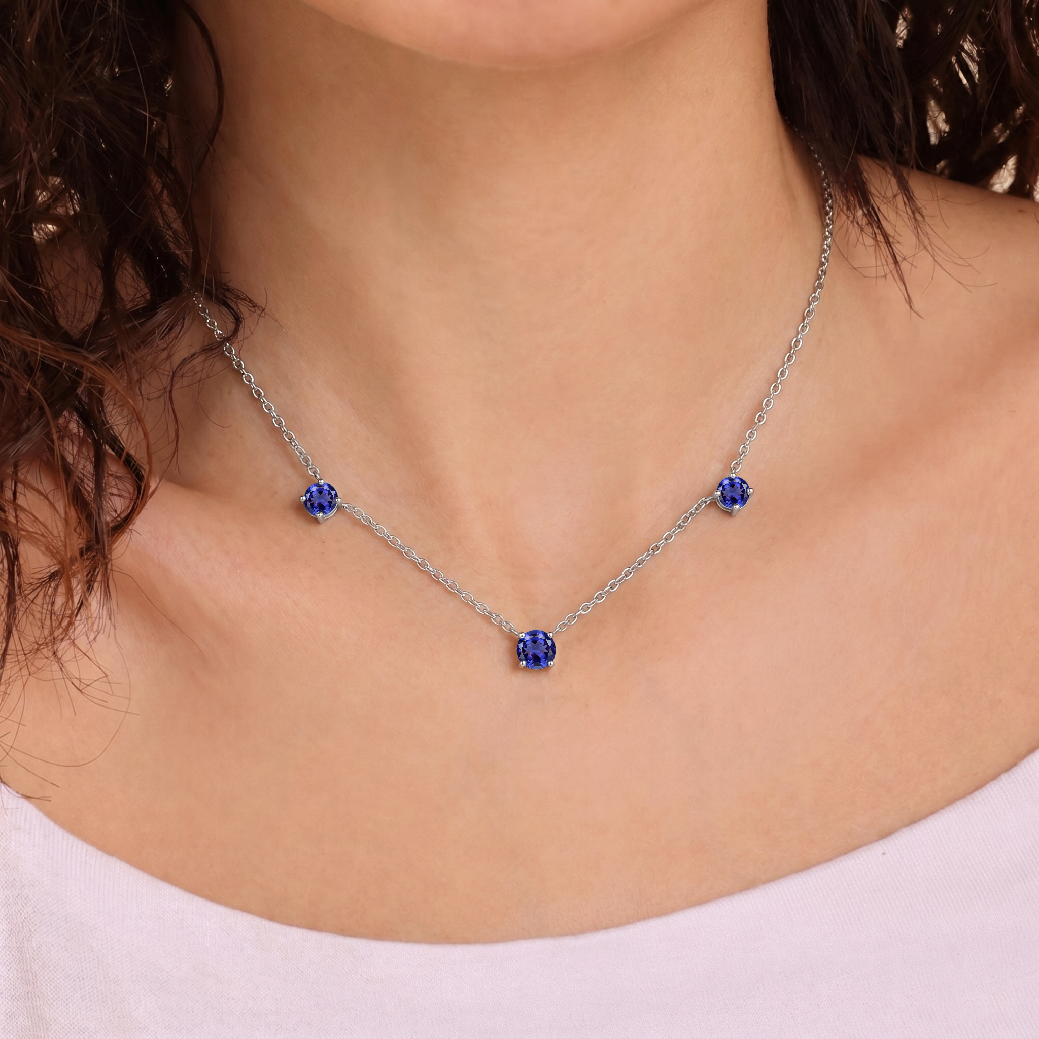 Elegant Tanzanite station necklace with blue violet gemstones for women.
