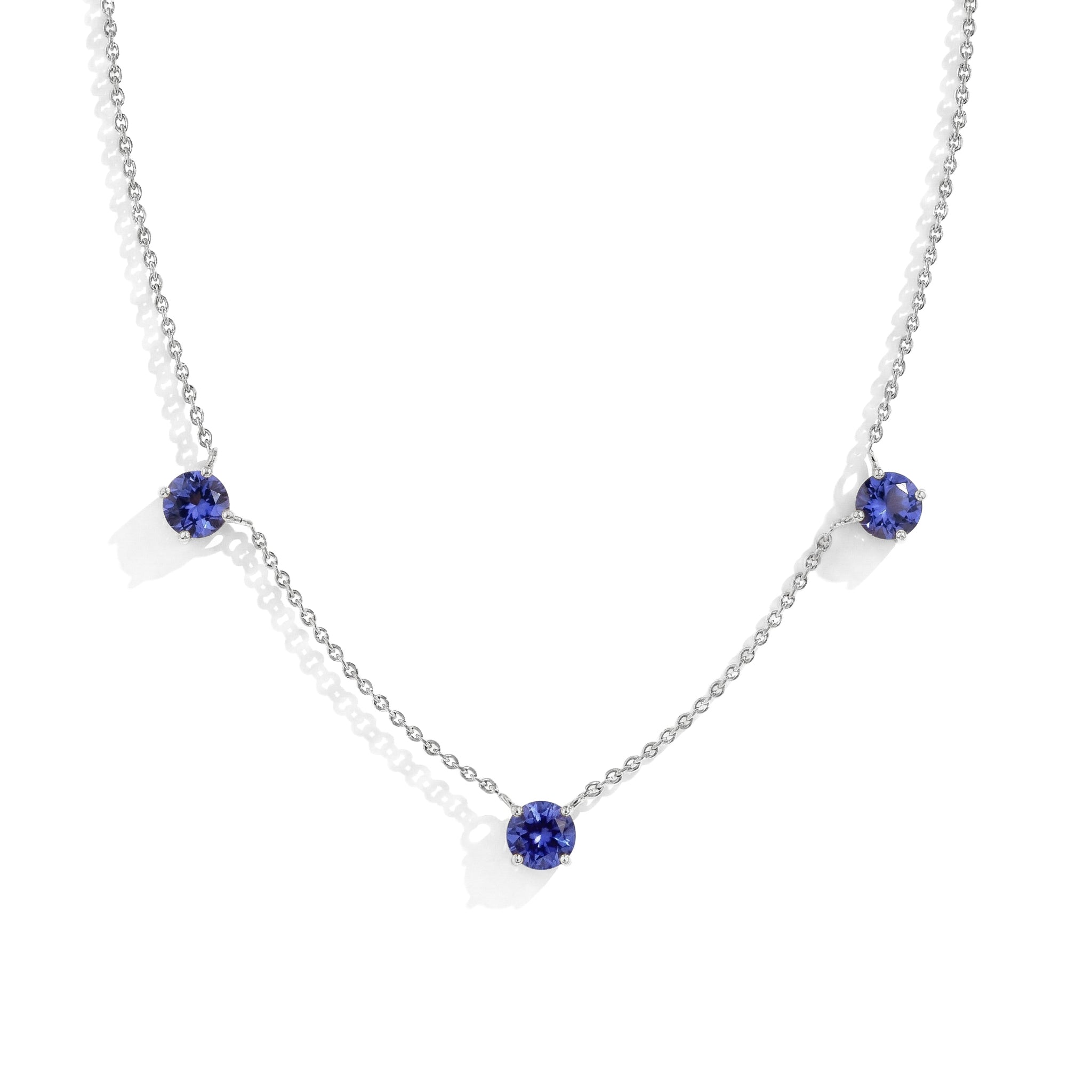 "Dainty Tanzanite necklace featuring three 5MM round gemstones in 925 Sterling Silver.
