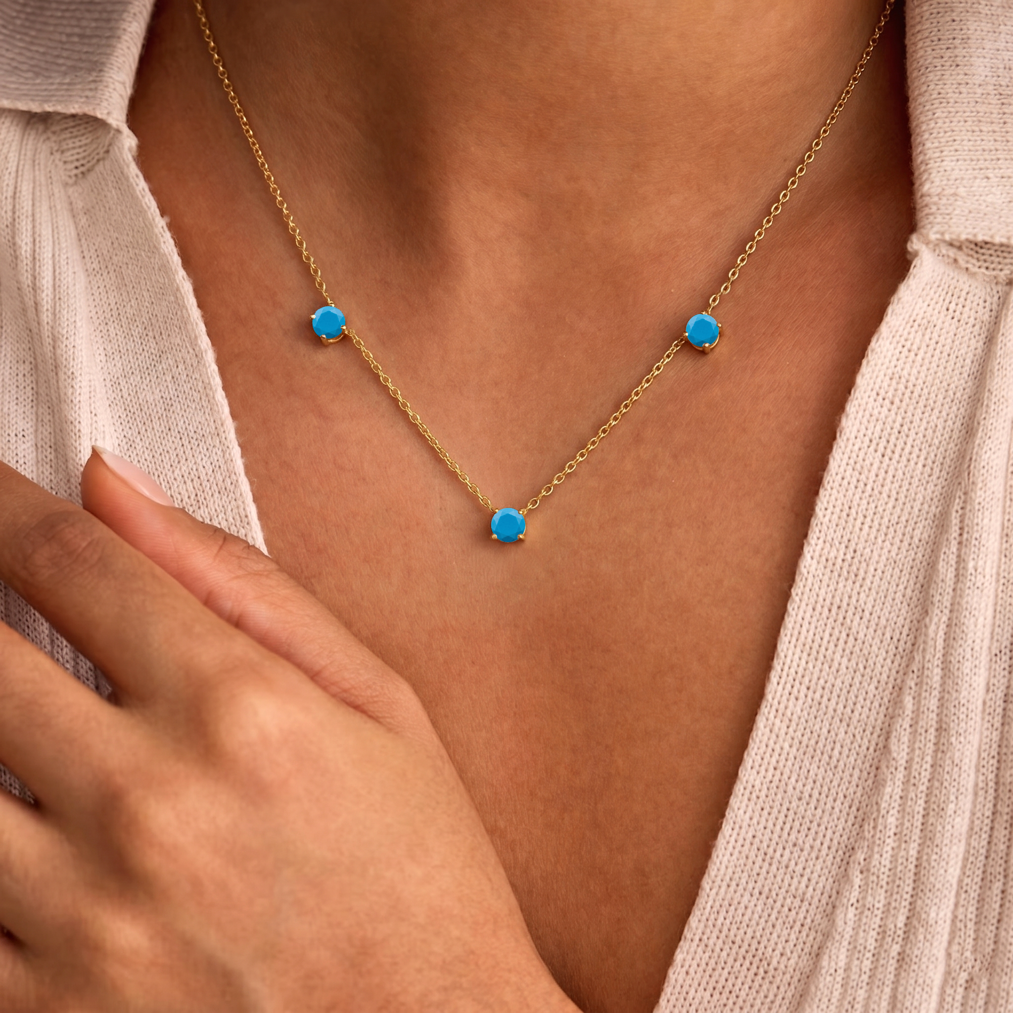 Fine jewelry Turquoise necklace with classic three stone station design.
