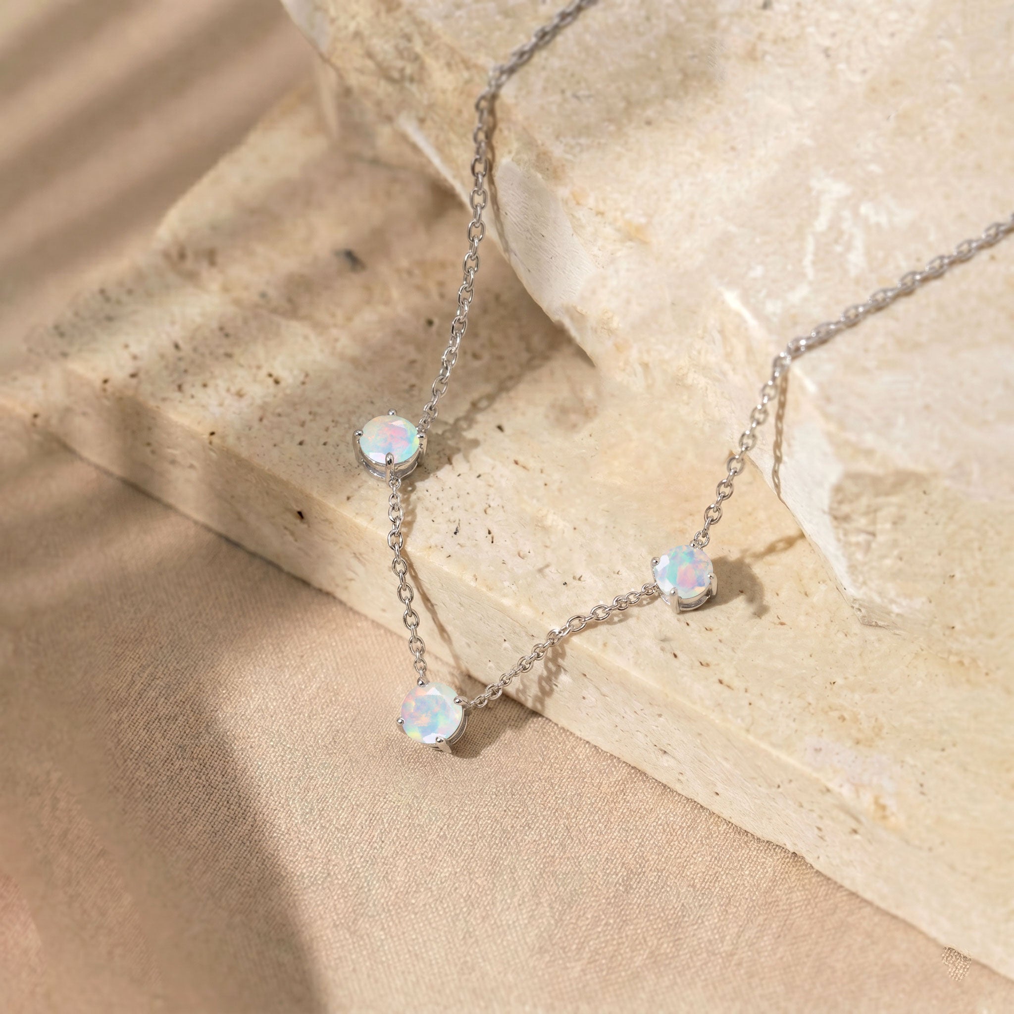 Three stone White Opal necklace designed with a minimalist and timeless jewelry style.

