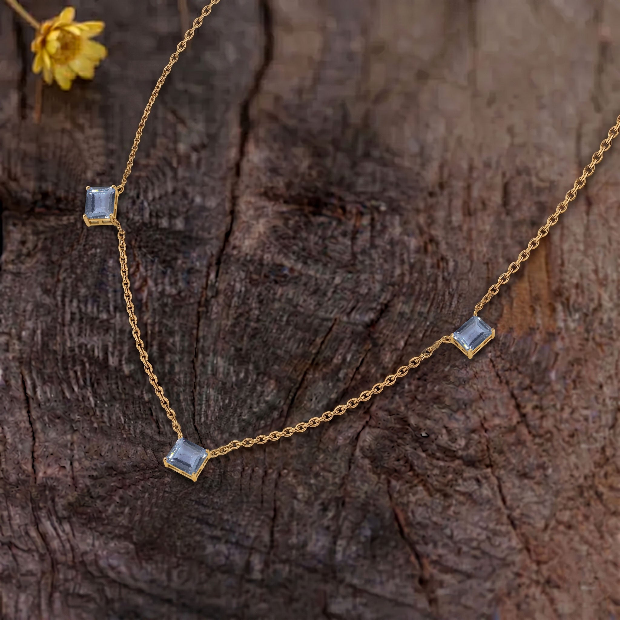 Three stone Alexandrite necklace featuring brilliant color-changing gemstones.
