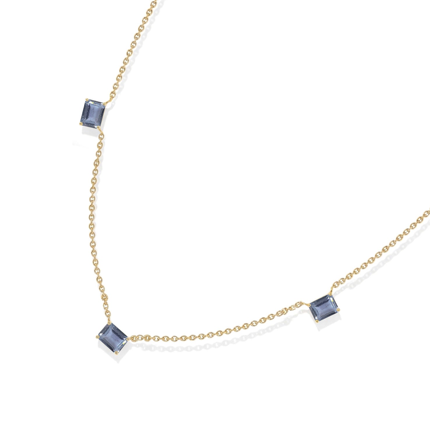 Fine jewelry Alexandrite station necklace with three octagon-cut gemstones.
