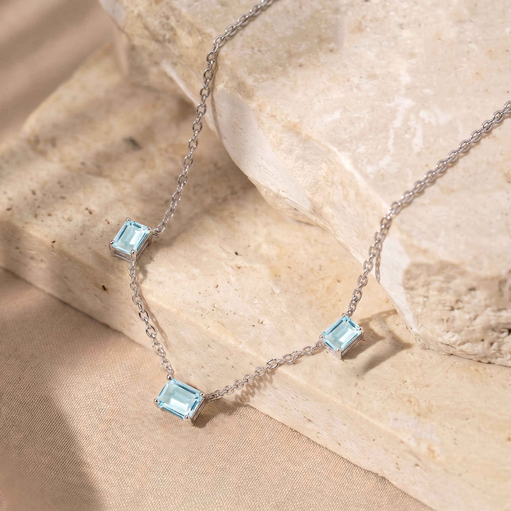 Dainty Aquamarine station necklace with a 16-inch chain and 2-inch extender.

