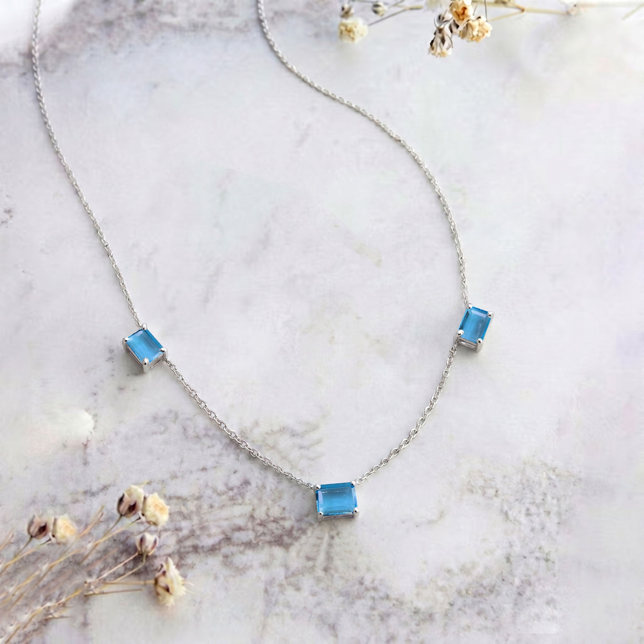 Handmade AAA Blue Topaz minimalist station necklace in Sterling Silver.
