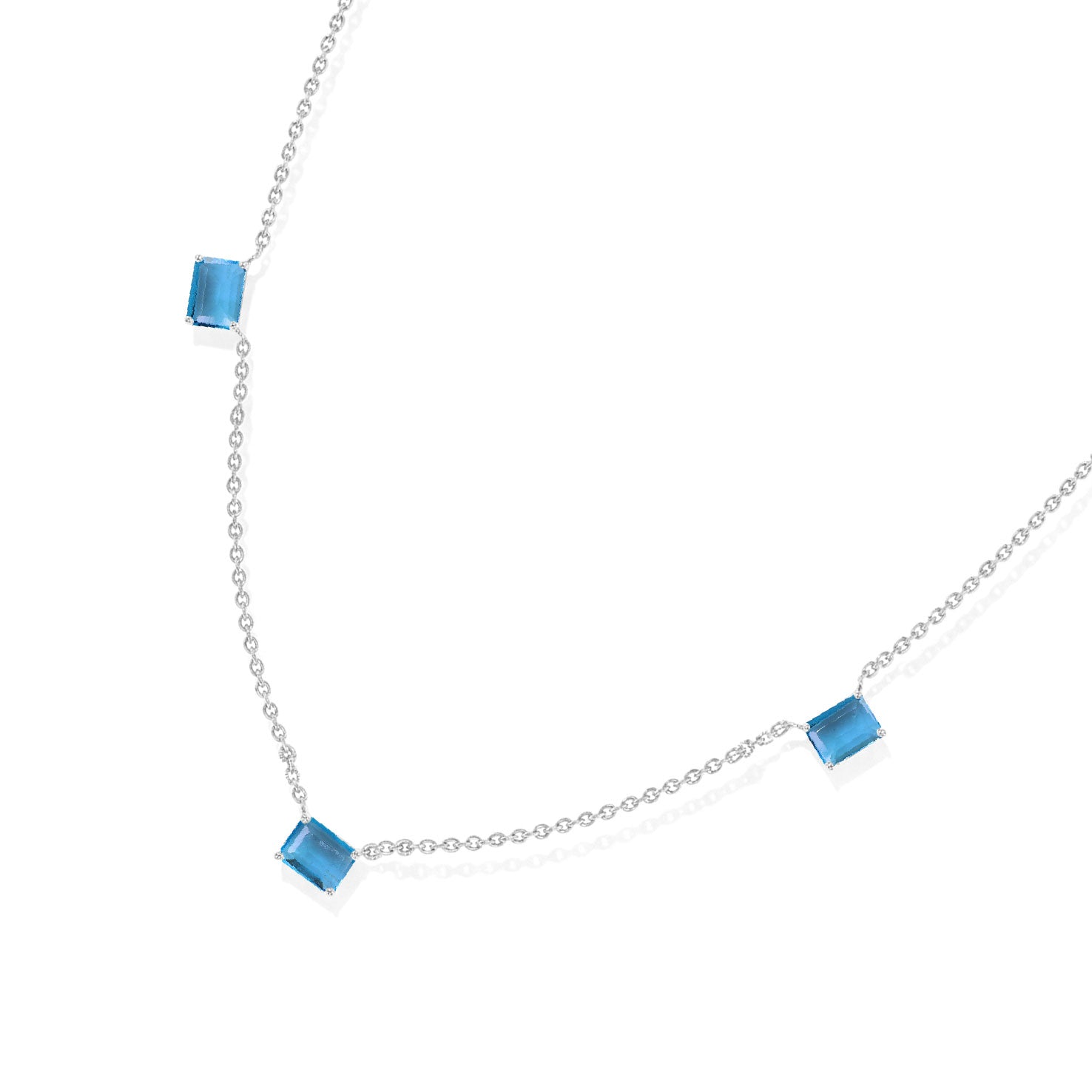 Genuine Blue Topaz station necklace featuring three 8x6mm octagon-cut gemstones.
