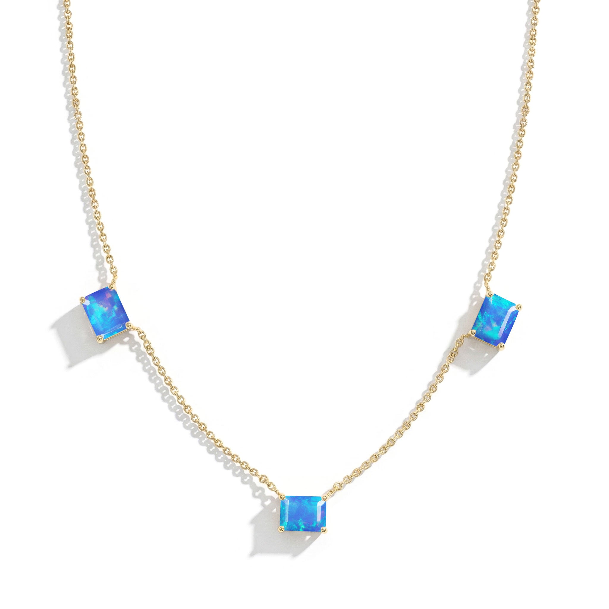 Sterling Silver Blue Opal station necklace with octagon-cut gemstones.
