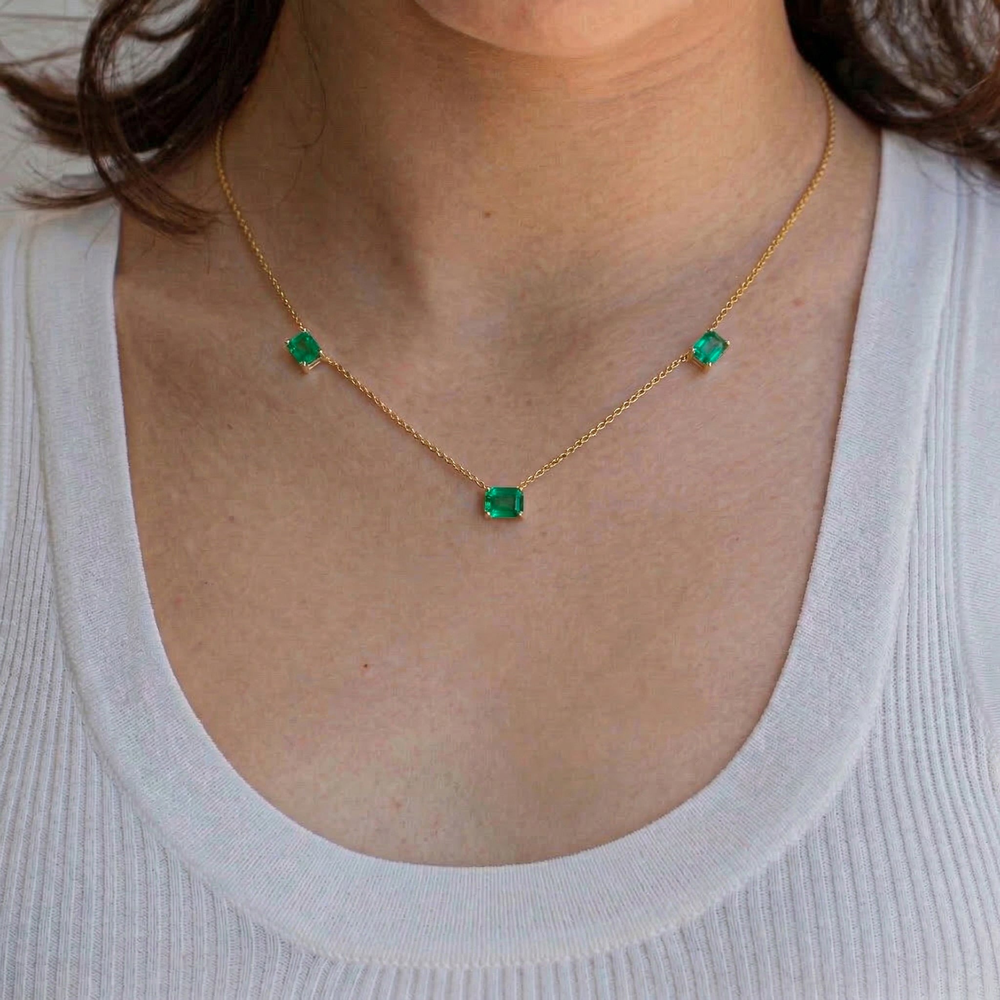 Genuine Emerald station necklace featuring three 8x6mm octagon-cut gemstones.
