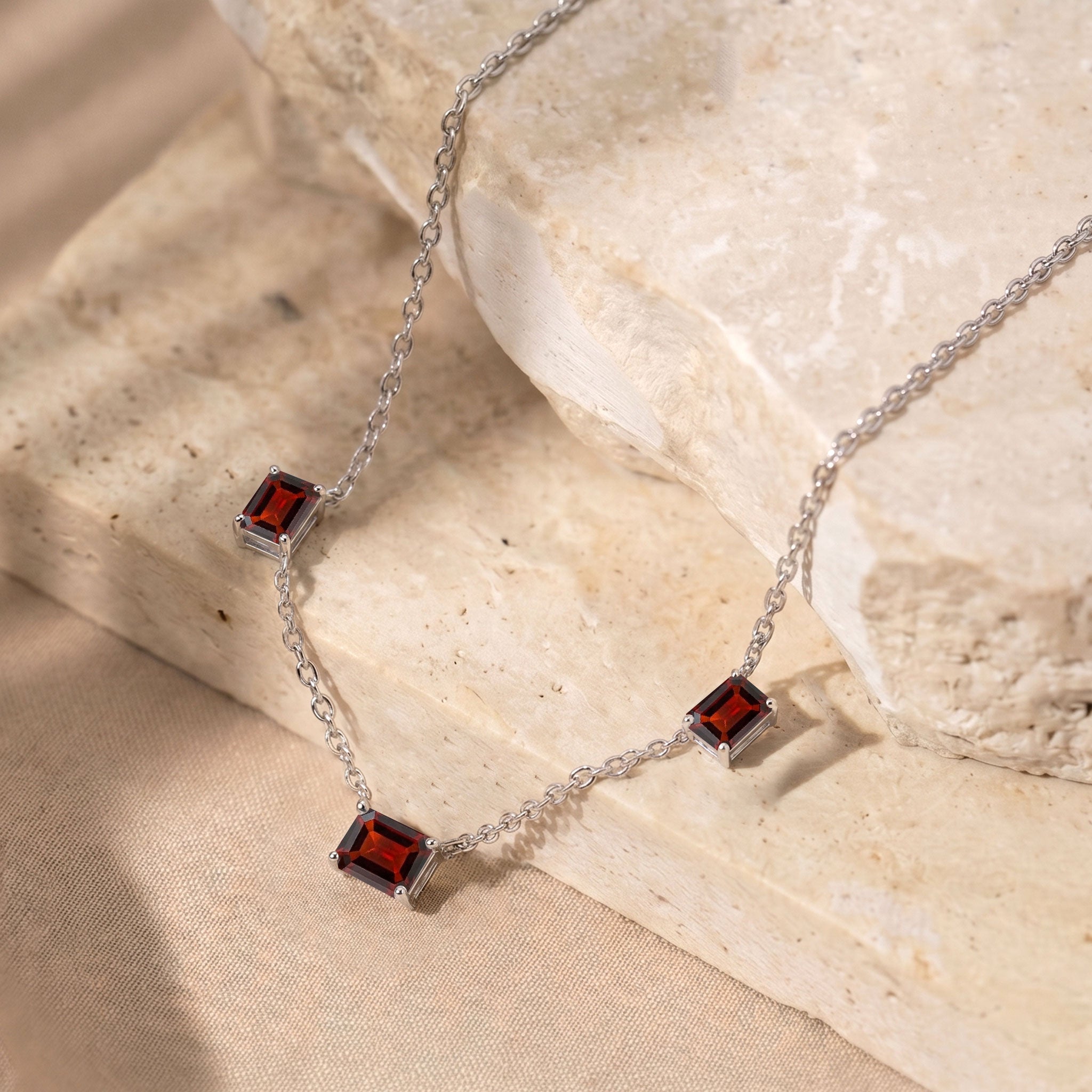 Dainty Garnet station necklace with a 16-inch chain and 2-inch extender.
