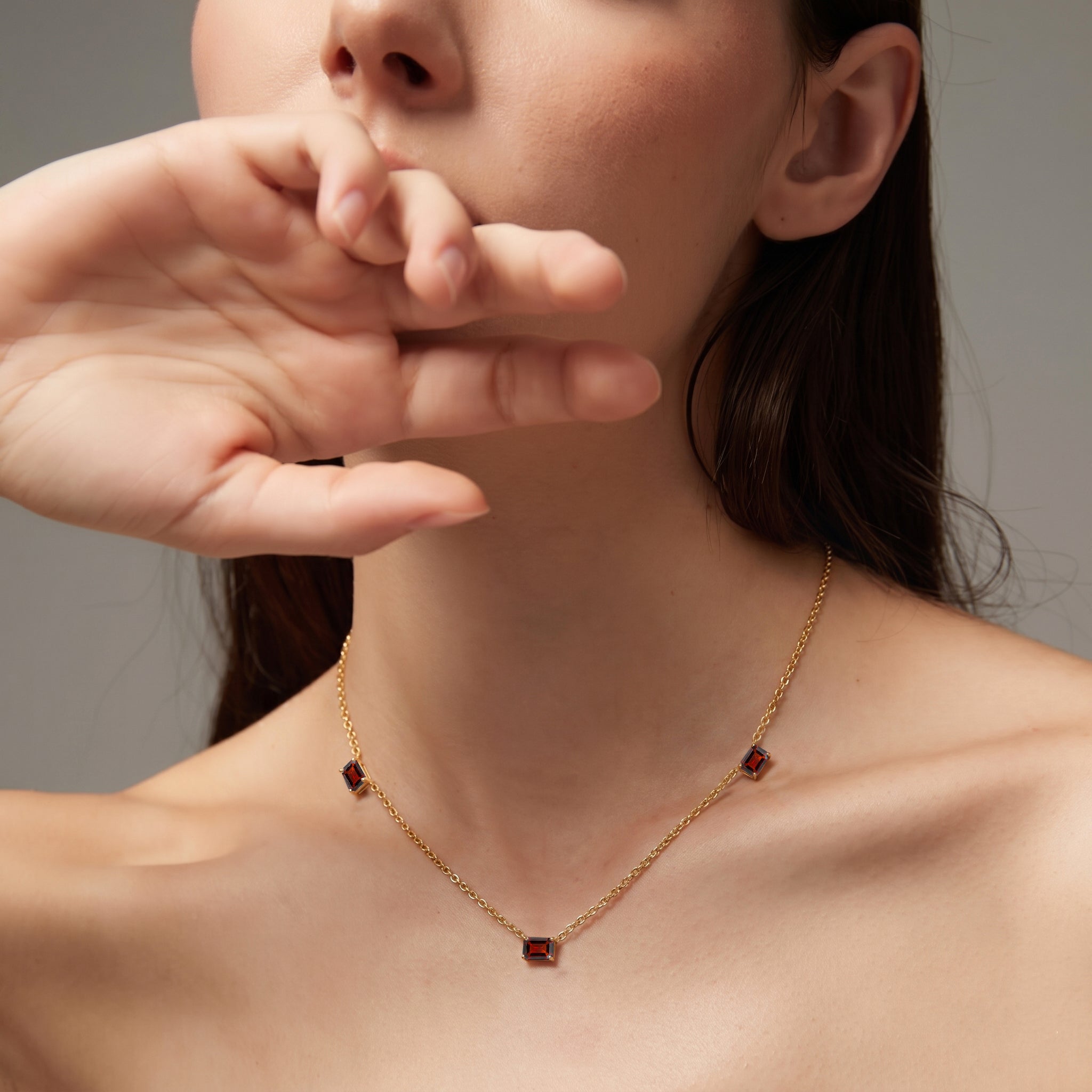 Sterling Silver Garnet station necklace with genuine octagon-cut gemstones.
