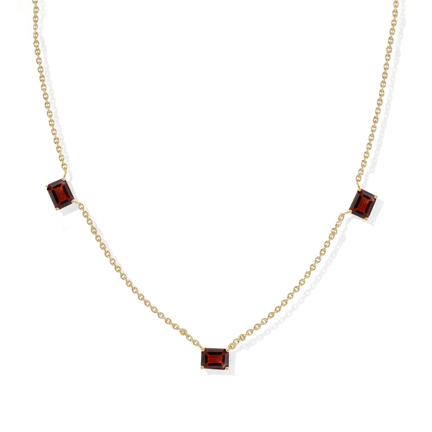 Three stone Garnet necklace featuring rich deep red gemstones.
