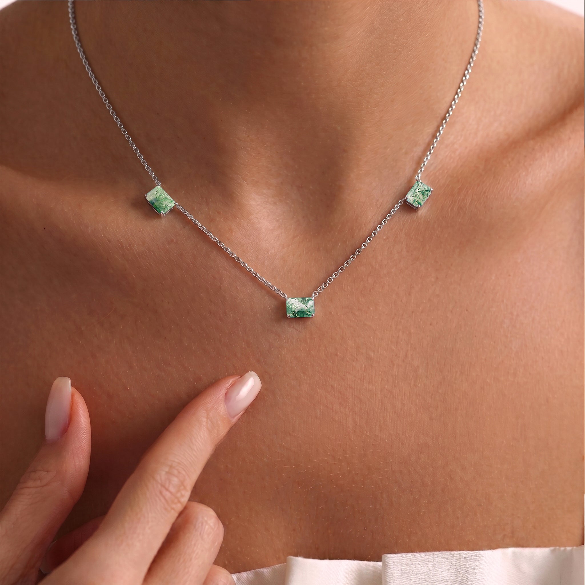 Dainty Moss Agate gemstone necklace with a 16-inch adjustable chain.
