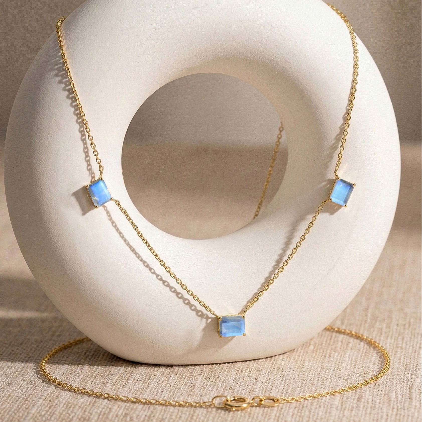 Three stone Moonstone necklace featuring a beautiful natural glow.
